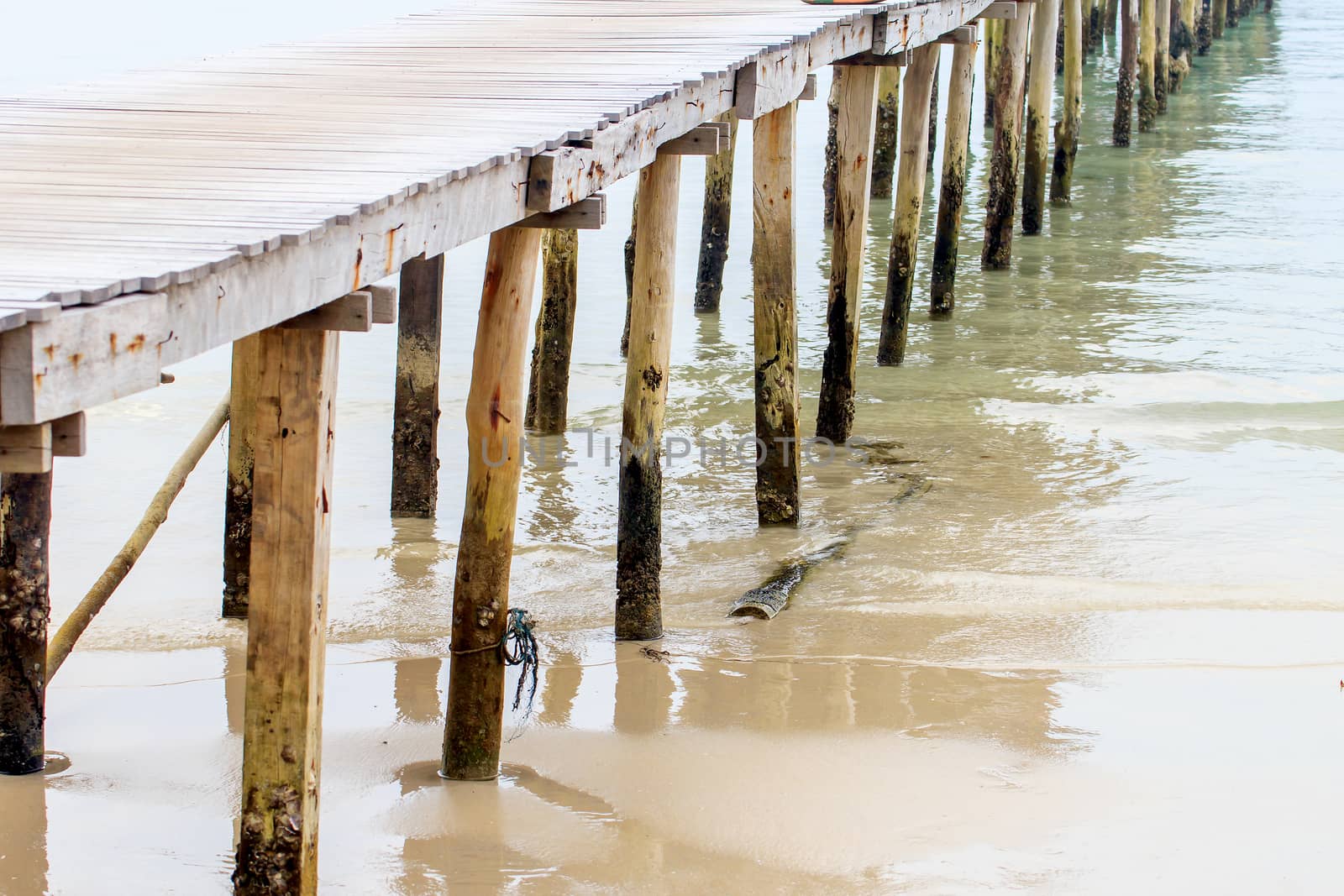 Wooden jetty over sea travel in the holidays.