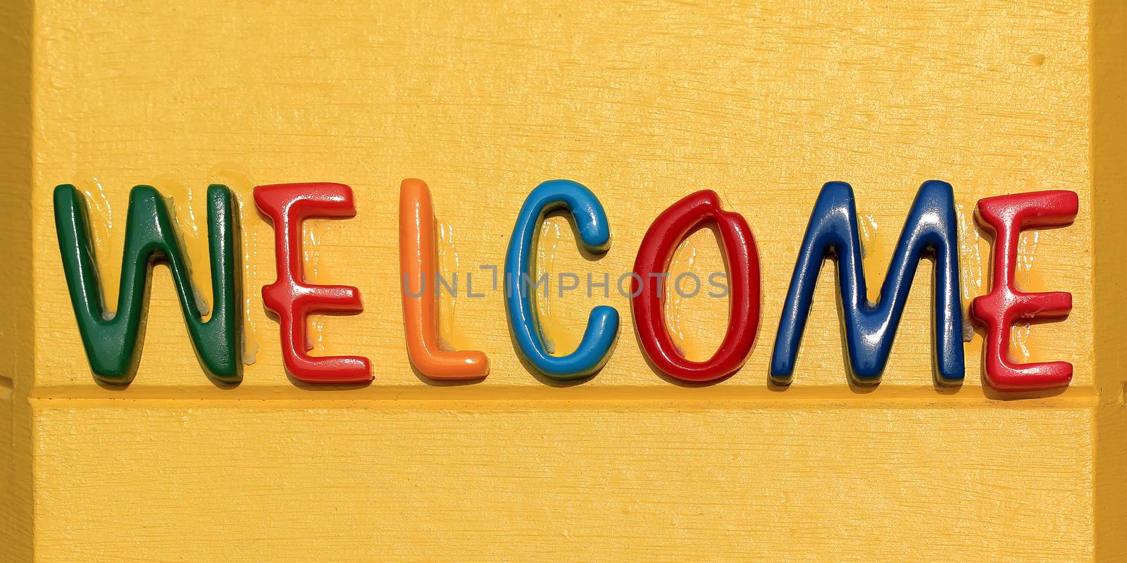 colorful of the welcome word on yellow plate