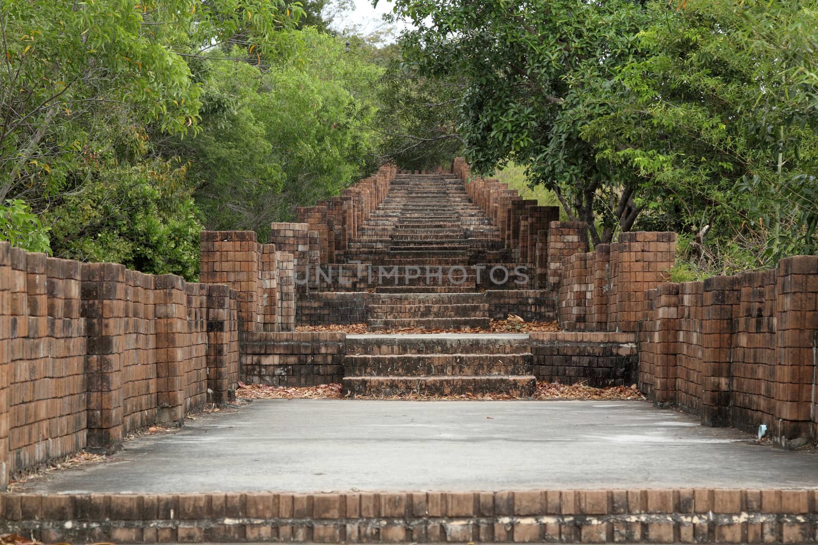 Path stone brick stairs at go to temple in Thailand