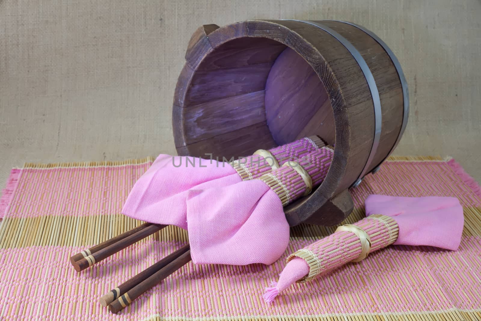 chopsticks in wood bucket