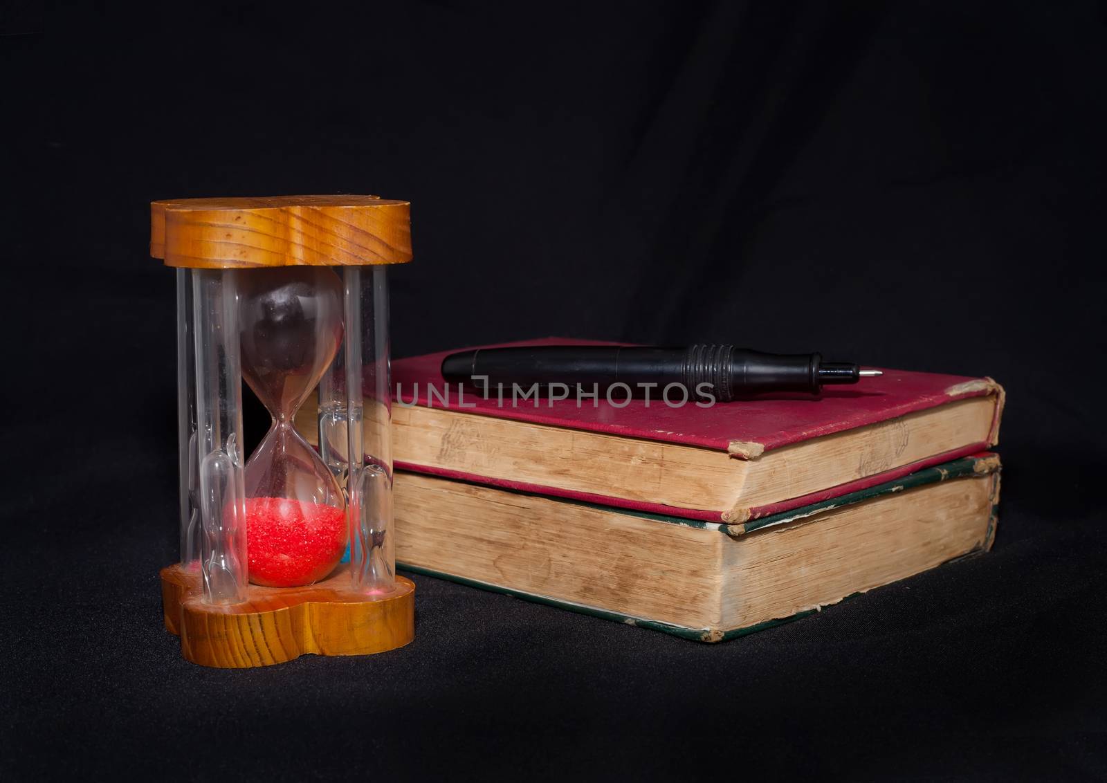vintage book and hourglass