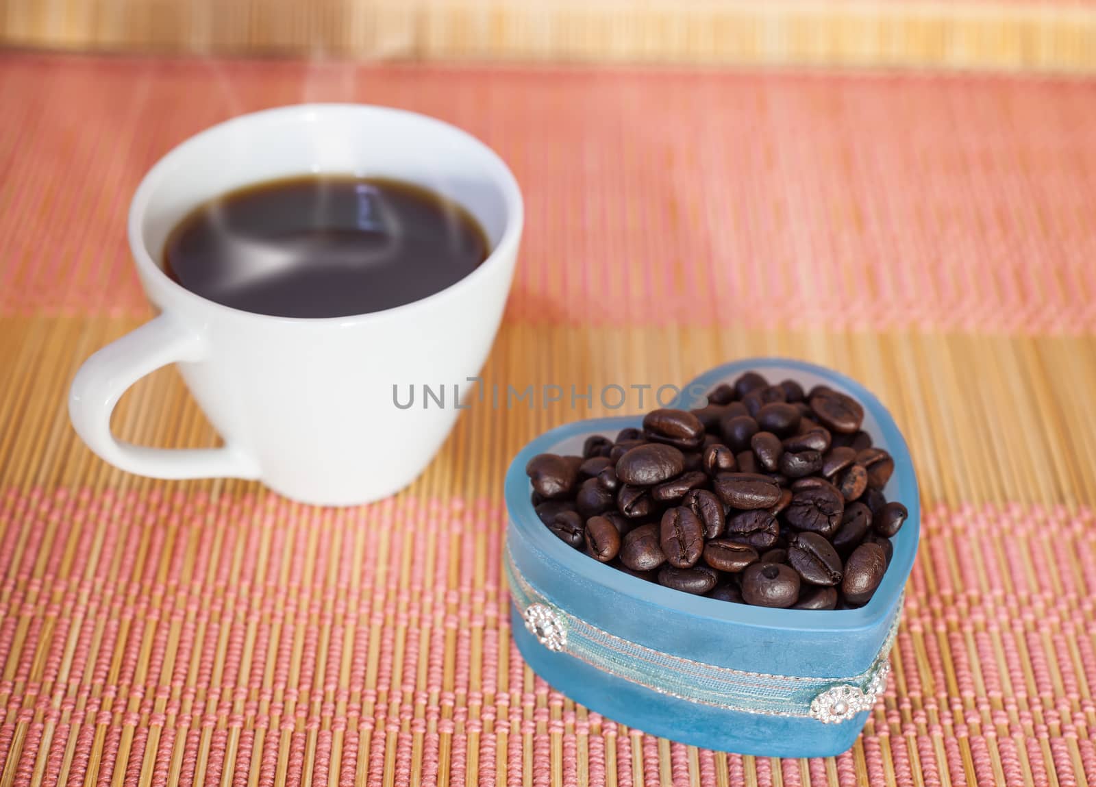 Cup of hot drink with coffee beam's