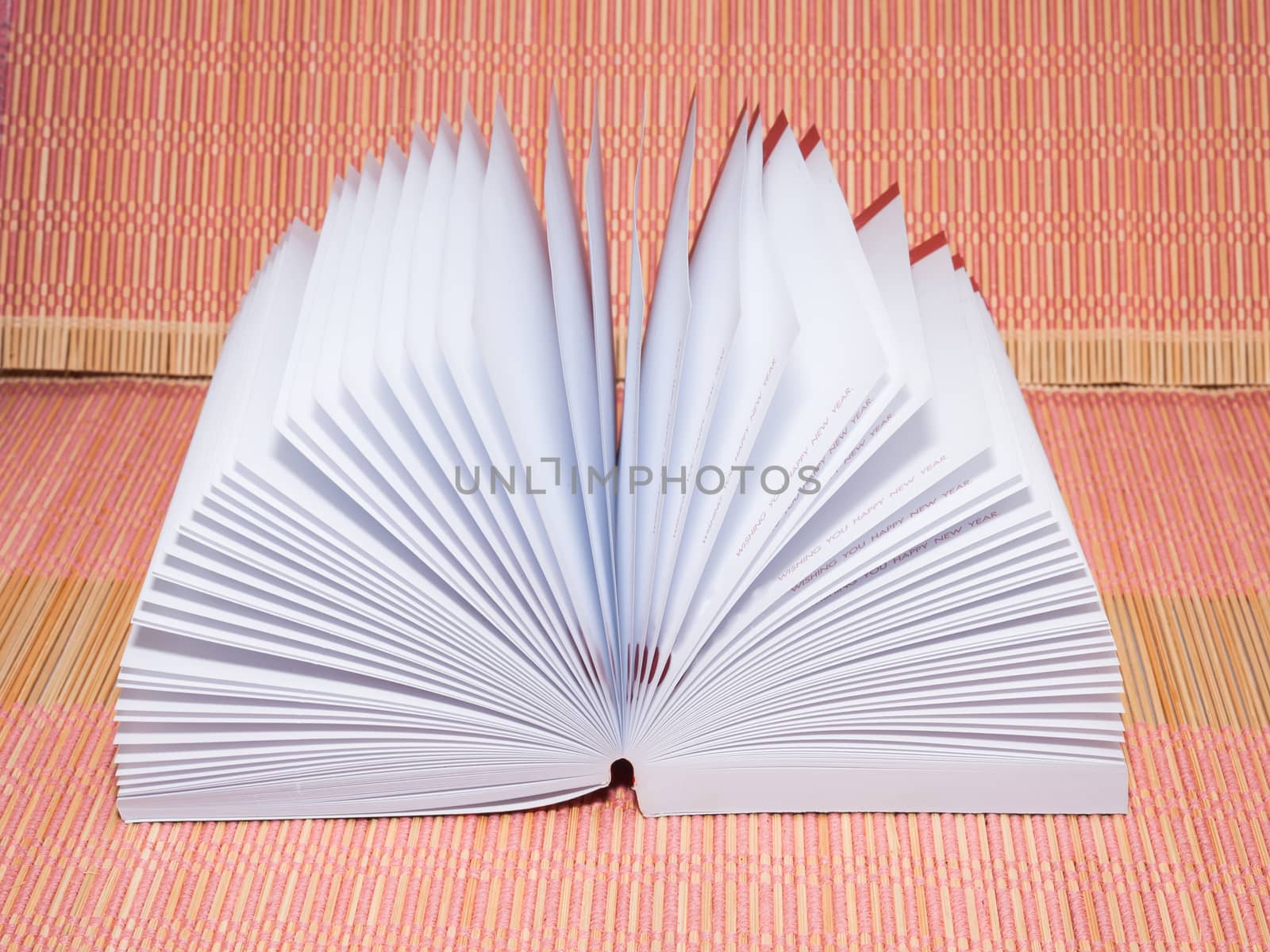 White opened booknote with blank pages