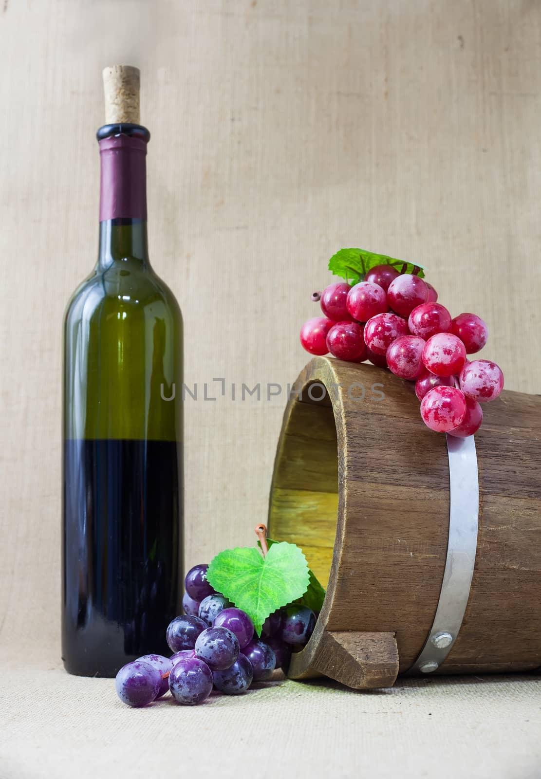 Red wine and grapes in vintage setting