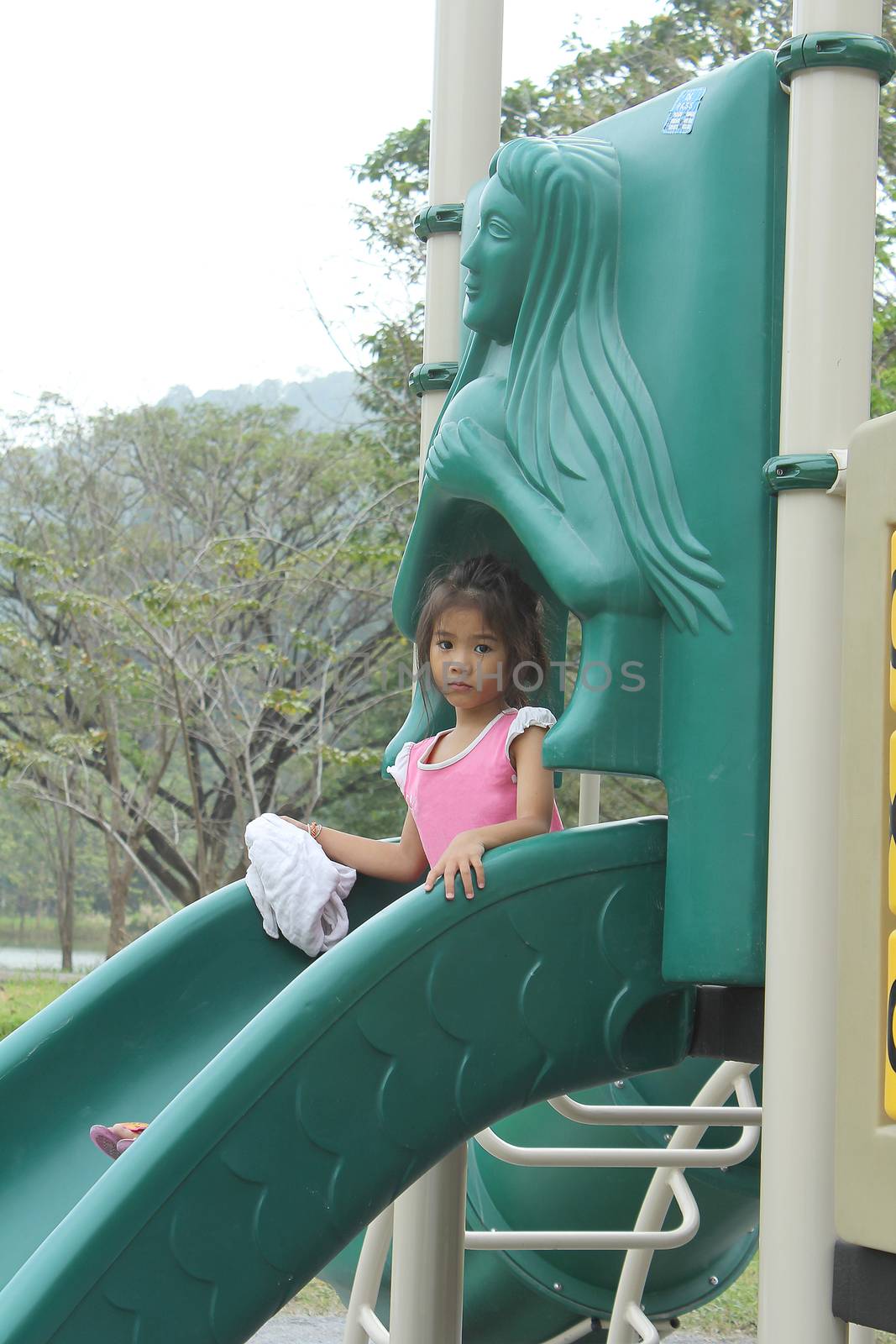 Asian little girl enjoy playground outdoor