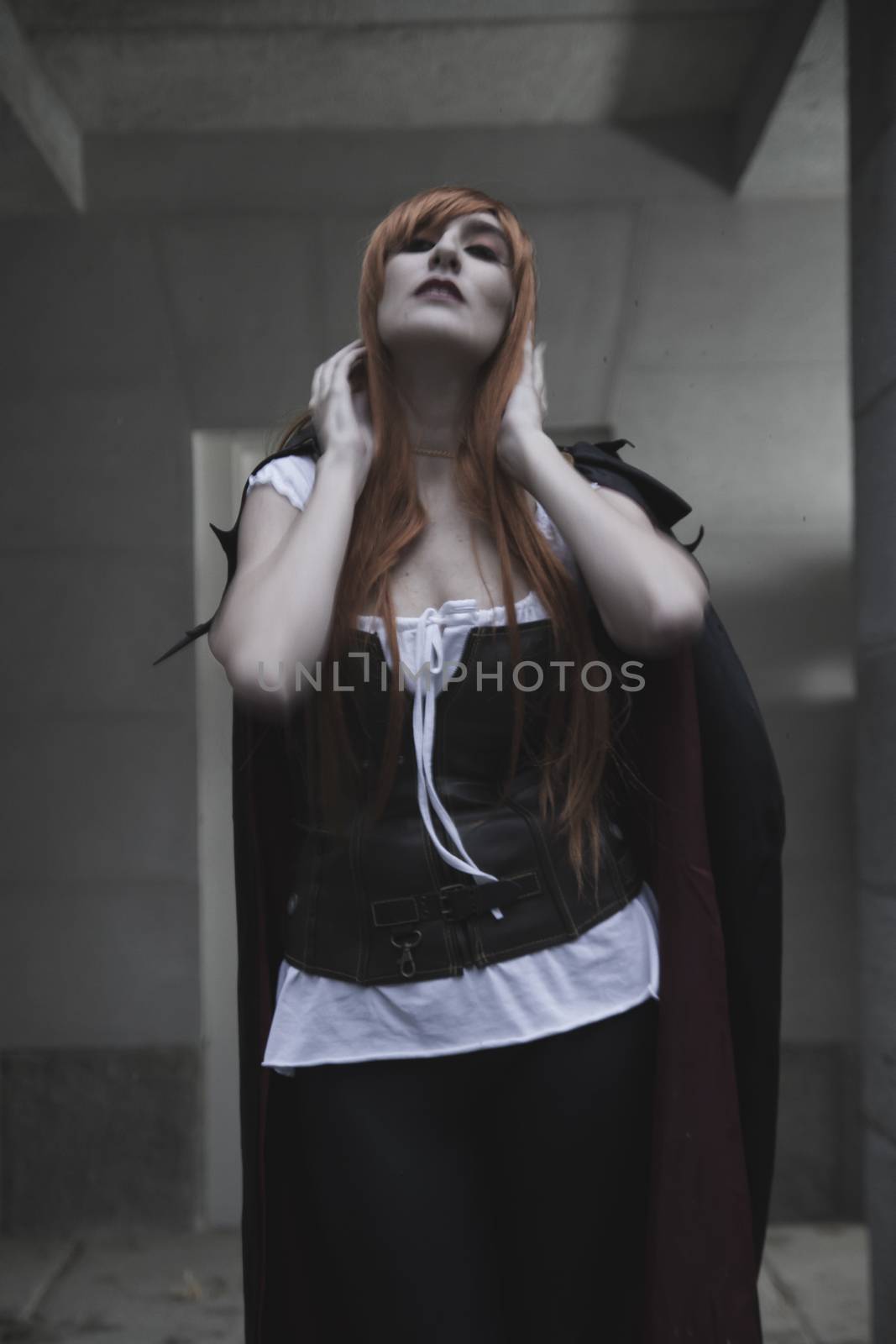 Dark beauty under rain, red hair woman with long black coat by FernandoCortes