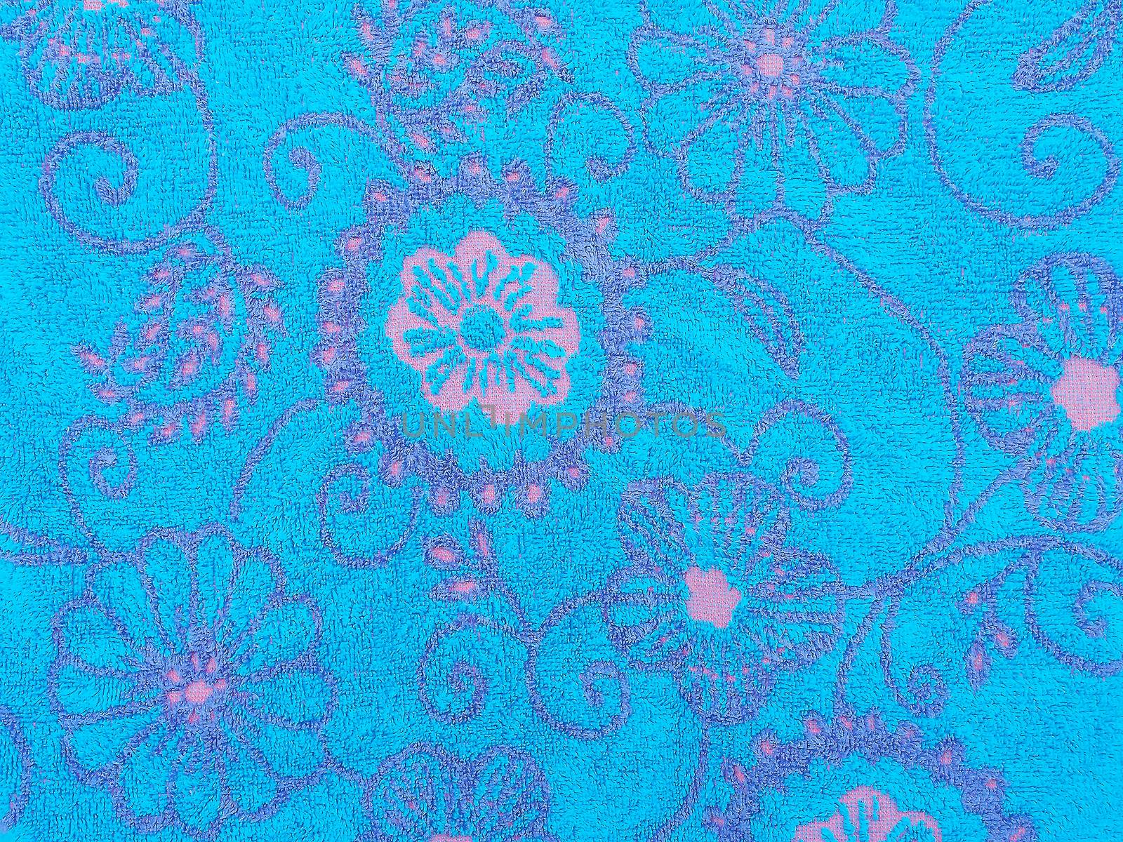 Close up of blue towel with floral pattern and texture abstract background
