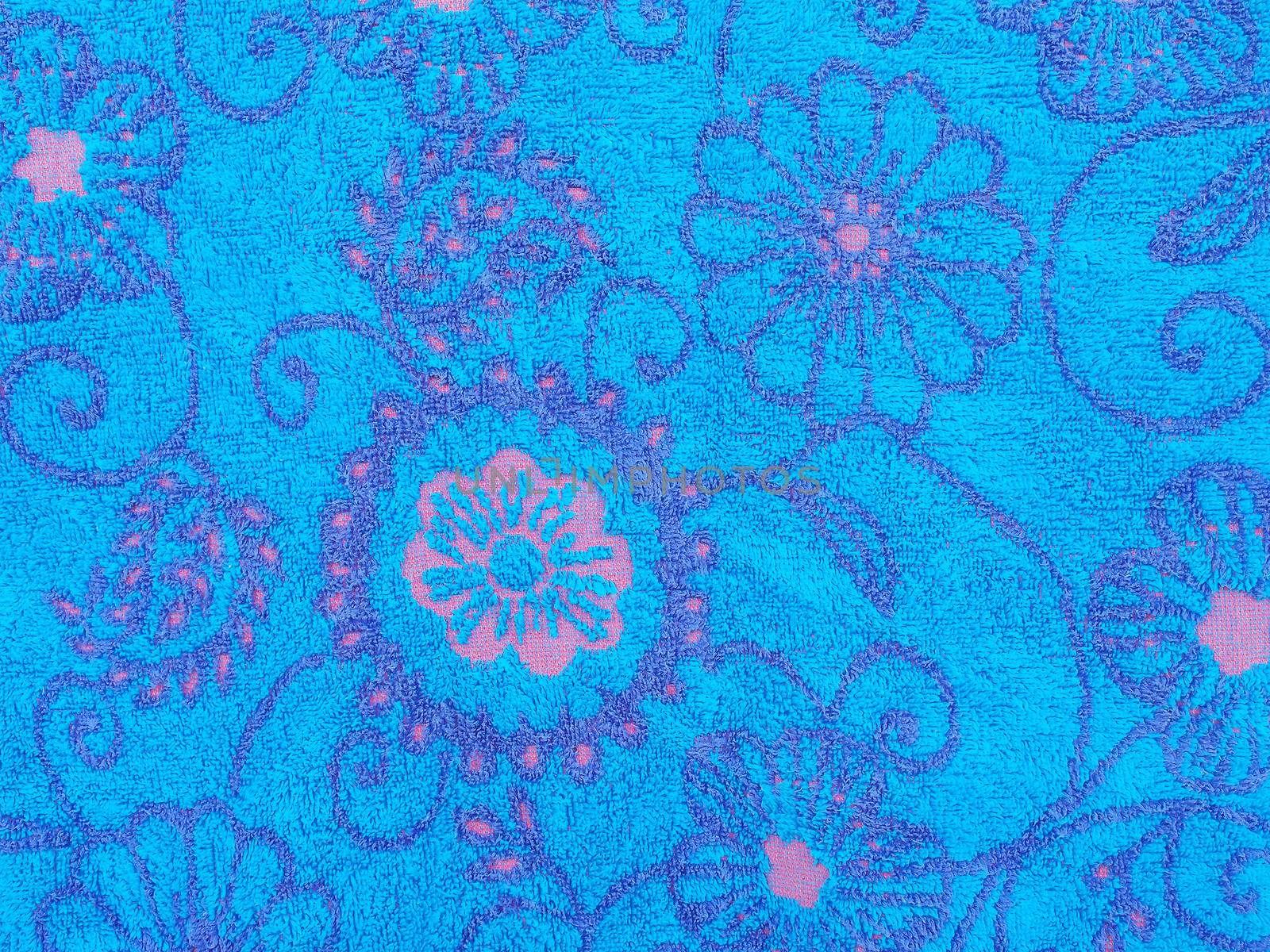 Close up of blue towel with floral pattern and texture abstract background