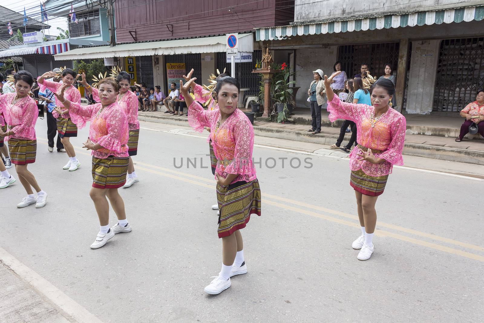 THAILAND - OCTOBER 20: Unidentified people participated in "Ngan Chak Pra", a traditional buddhist festival on October 20, 2013 in Chaiya,Suratthani, Thailand.