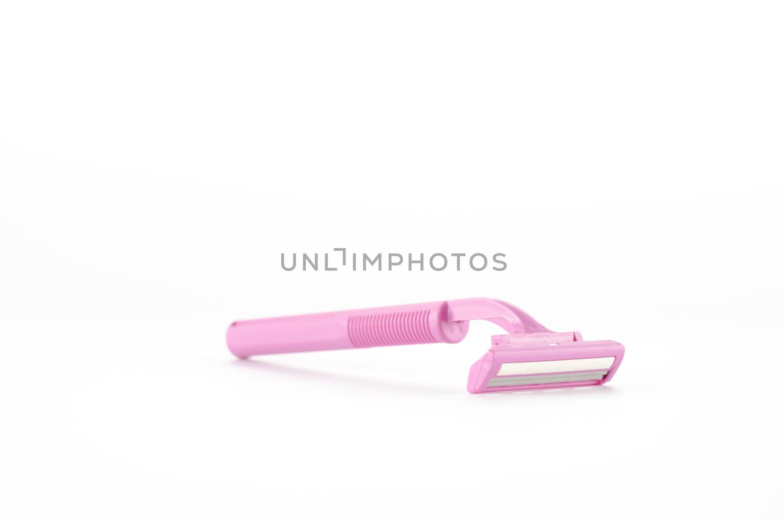 pink disposable shaving on a white background