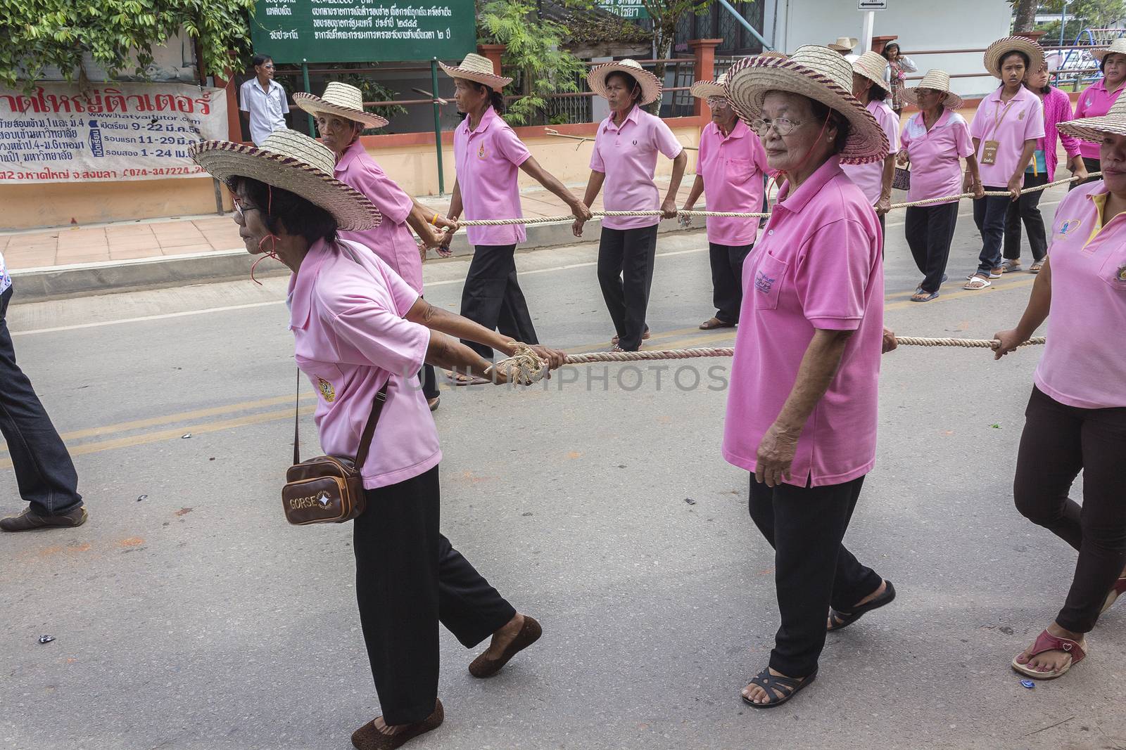 THAILAND - OCTOBER 20: Unidentified people participated in "Ngan Chak Pra", a traditional buddhist festival on October 20, 2013 in Chaiya,Suratthani, Thailand.