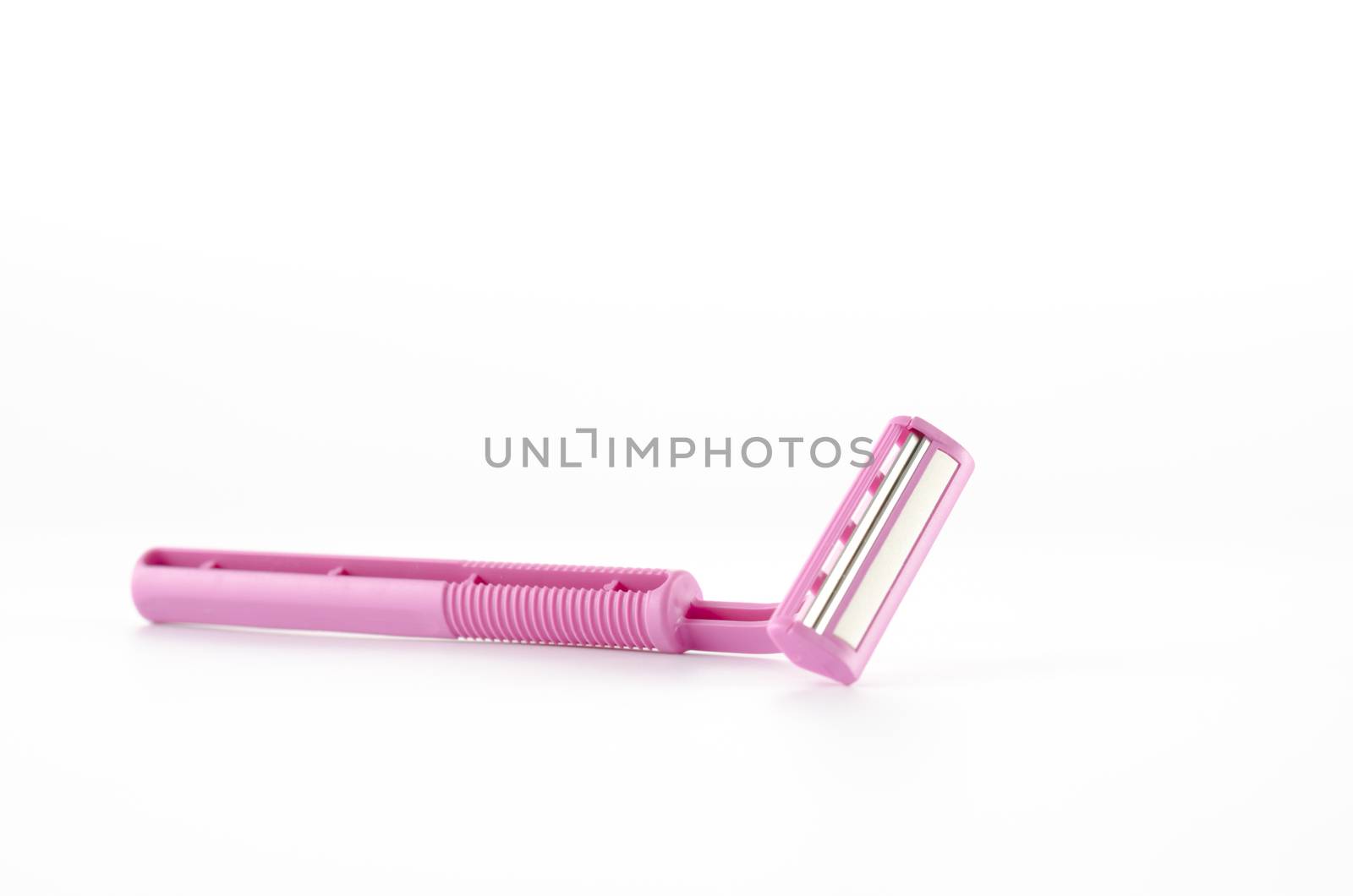 pink disposable shaving on a white background