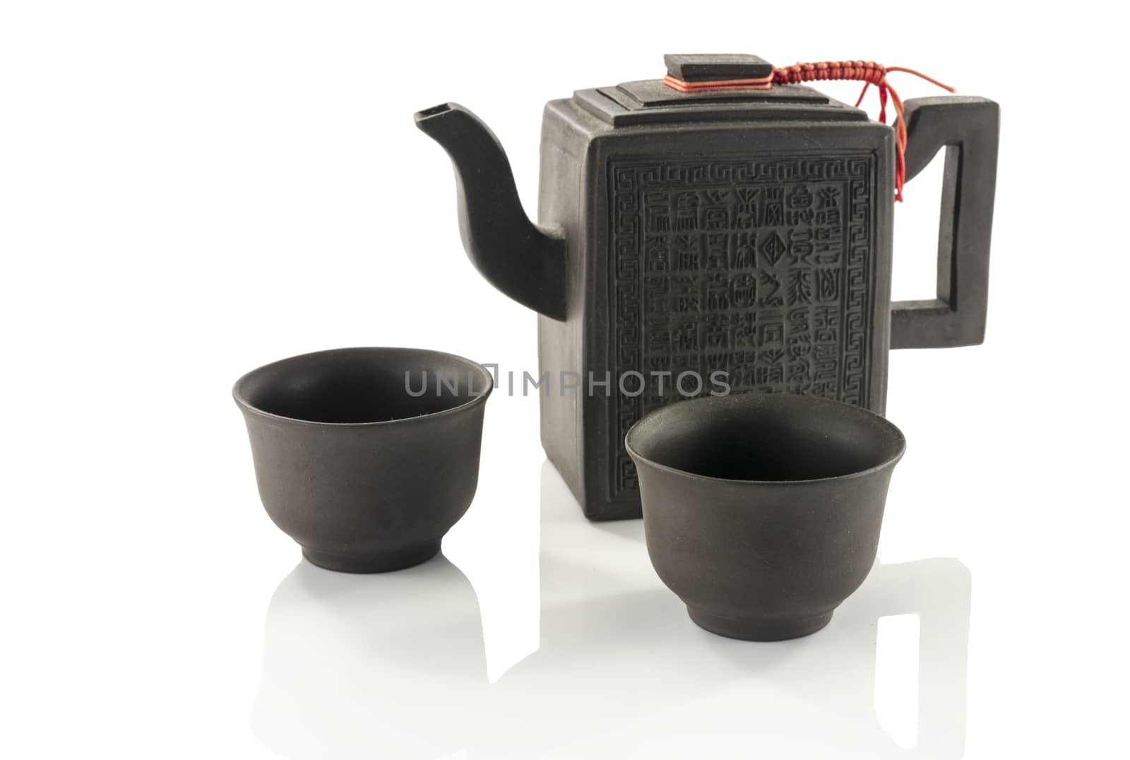 asian teapot and two cups isolated on white