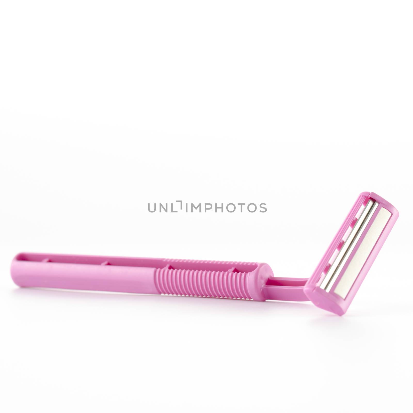 pink disposable shaving on a white background