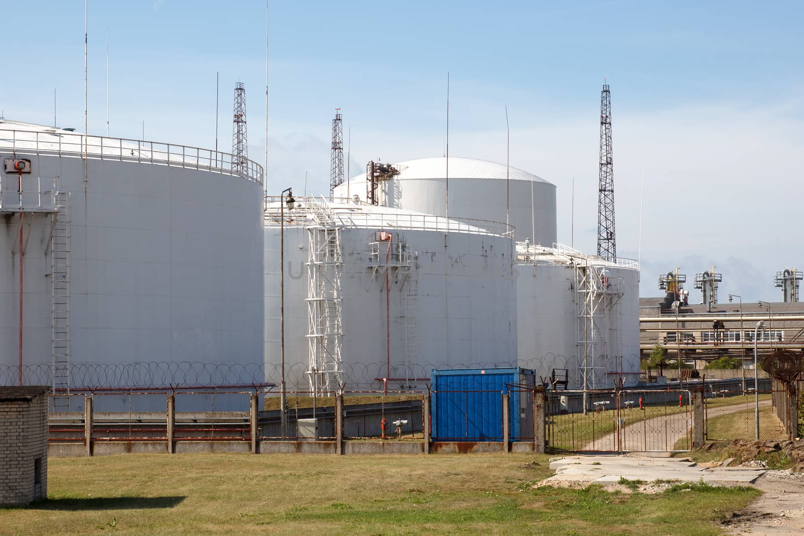 Big white industrial oil tanks to keep oil