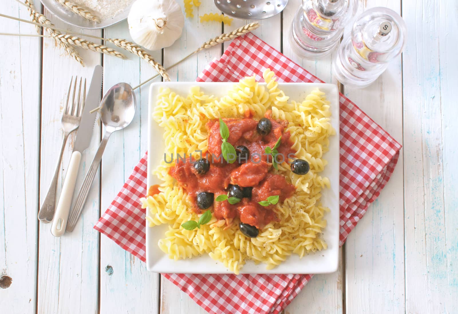 Italian pasta dish with tomato sauce and basil 
