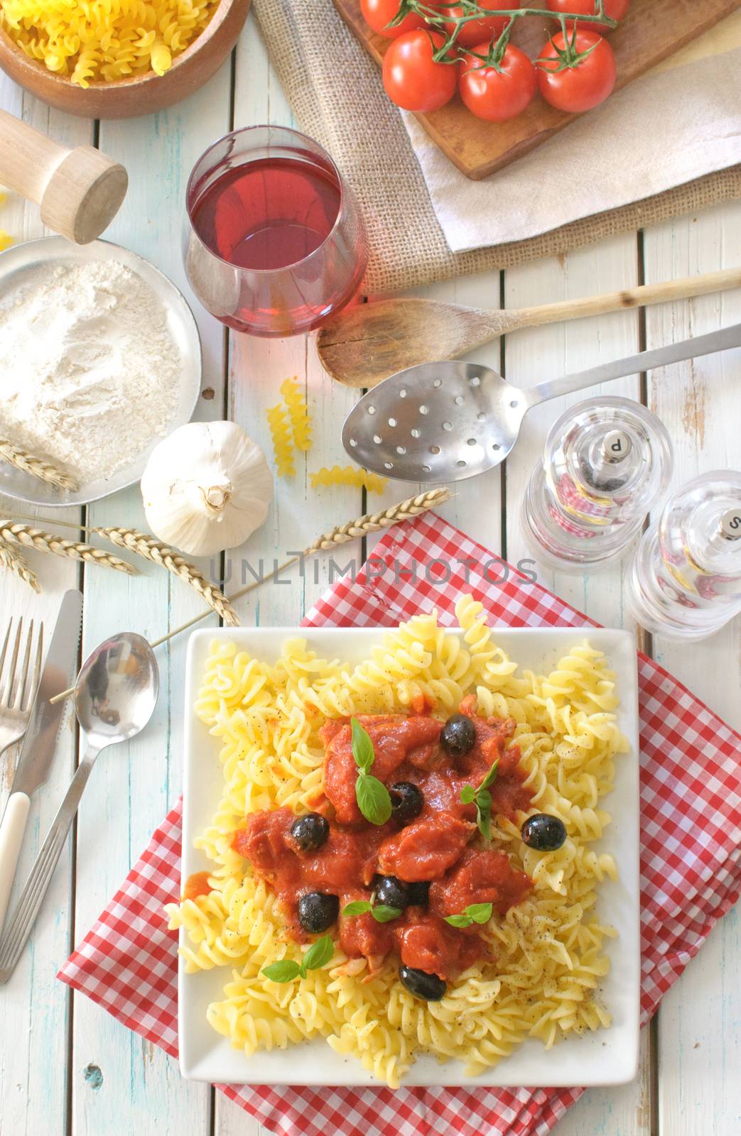 Italian pasta dish with tomato sauce and basil 