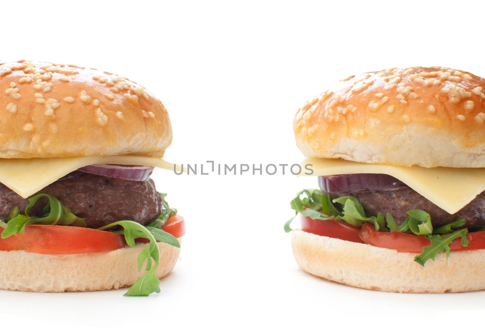Two quarter pounder hamburgers with cheese and tomatoes 