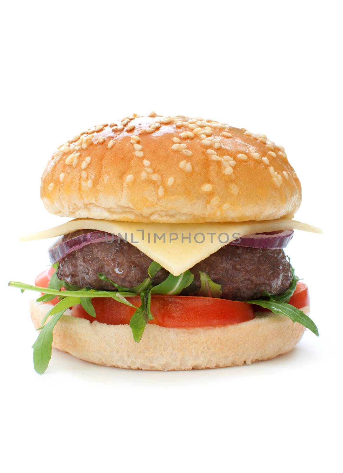 Quarter pounder hamburger with tomatoes onions and lettuce over a white background