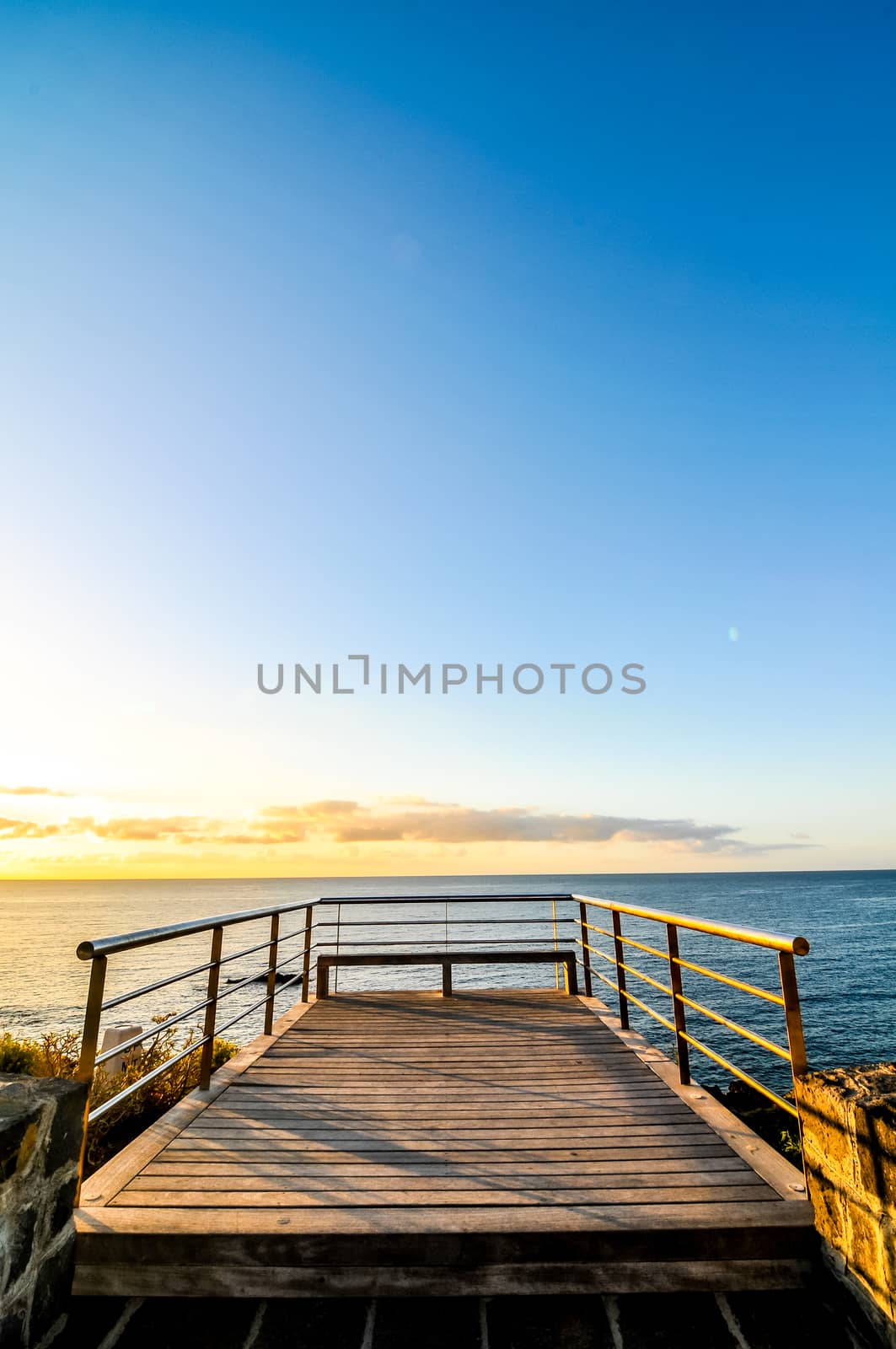 Sunrise on a Pier over Atlantic Ocean in Tenerife Canary Islands Spain