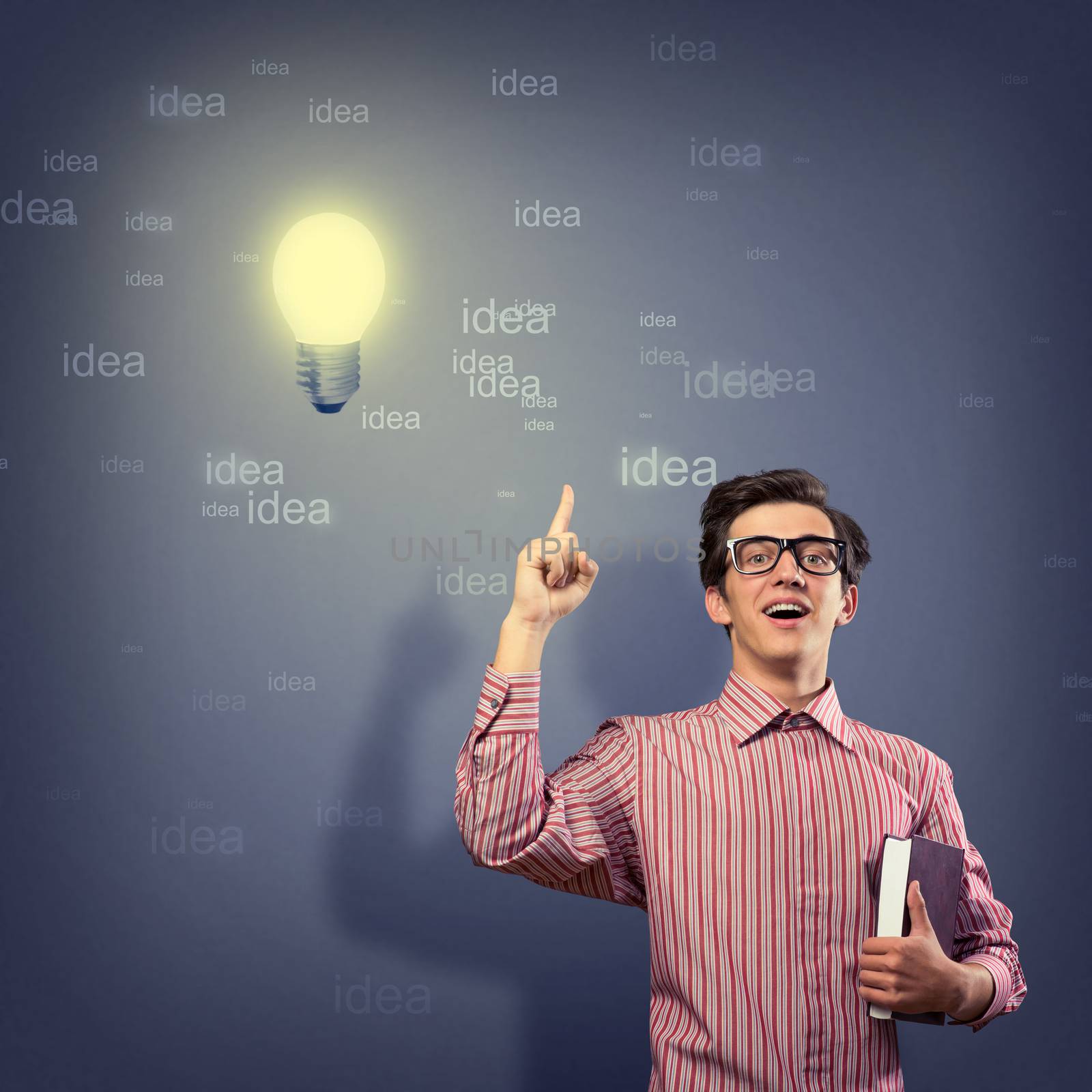 young man holding a book in front of him, raised his hand, the idea