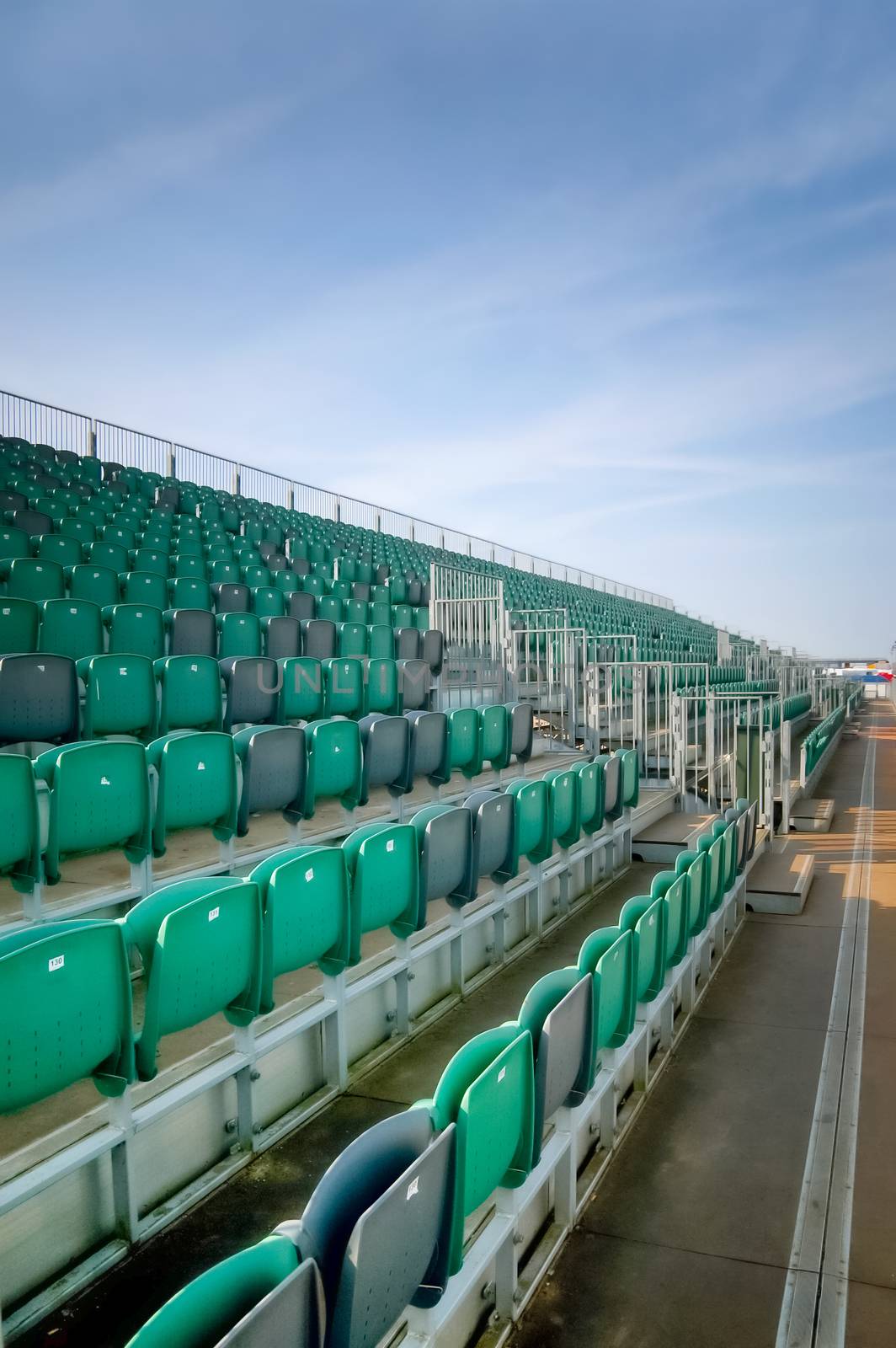 empty grandstand seating at an outdoor sports venue