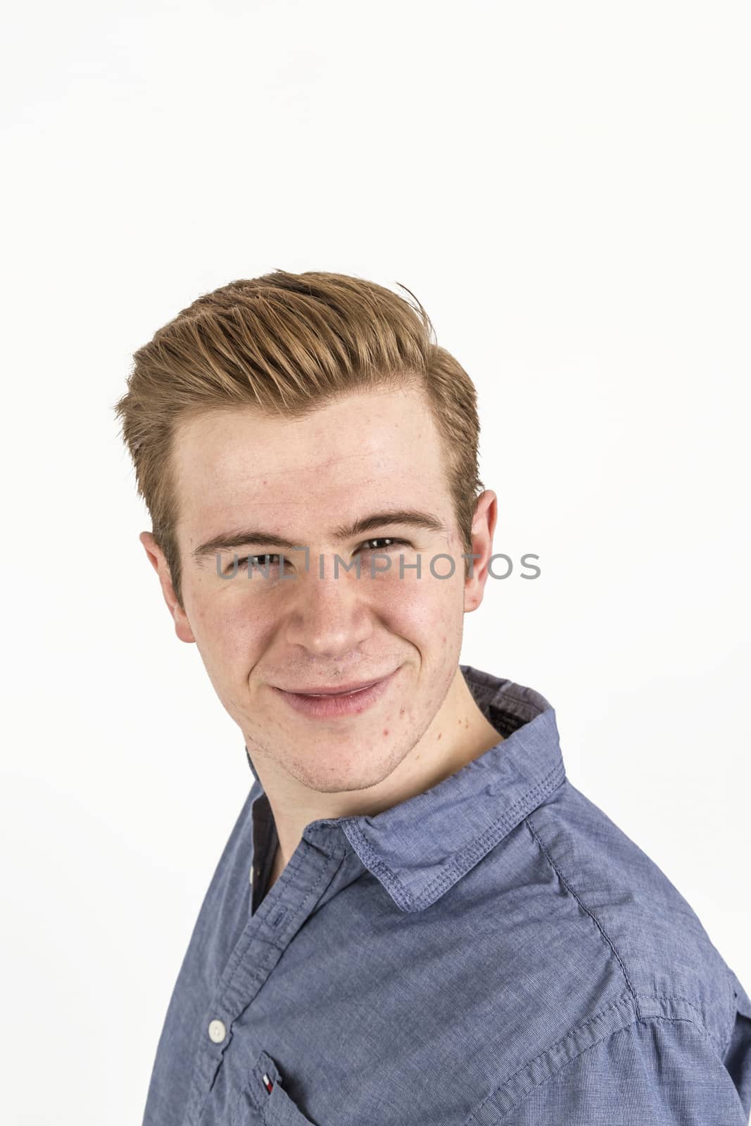 portrait of cool boy with red hair posing in studio