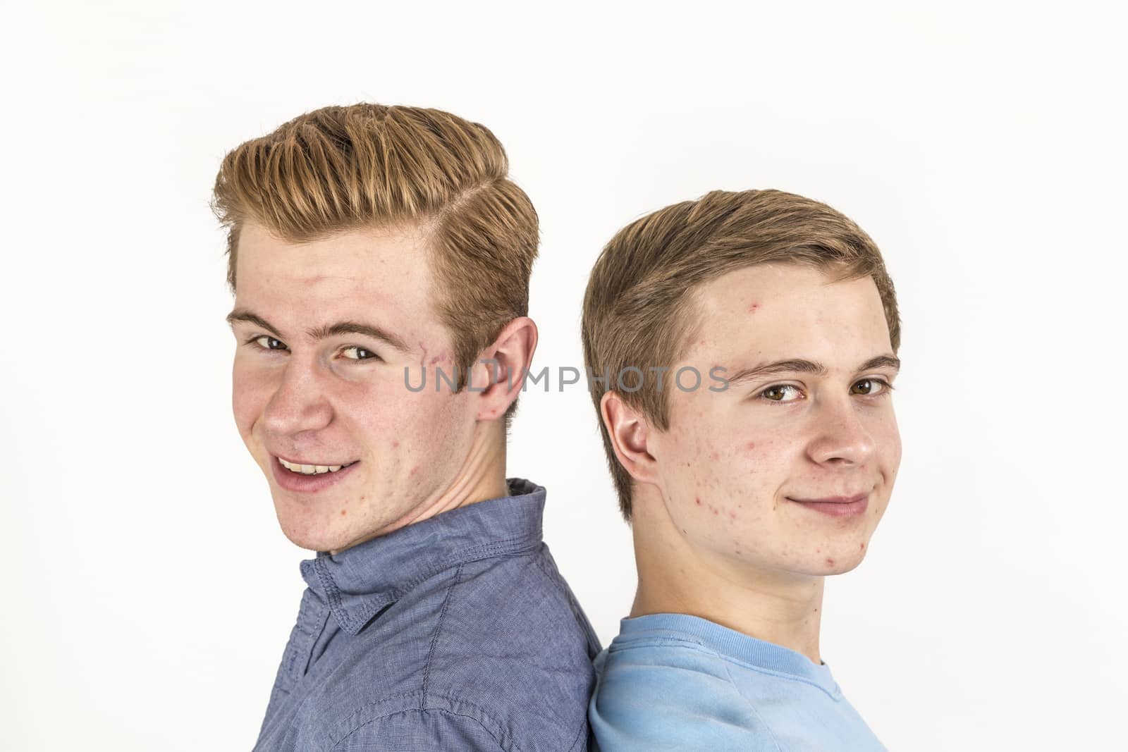 portrait of handsome brothers posing in studio