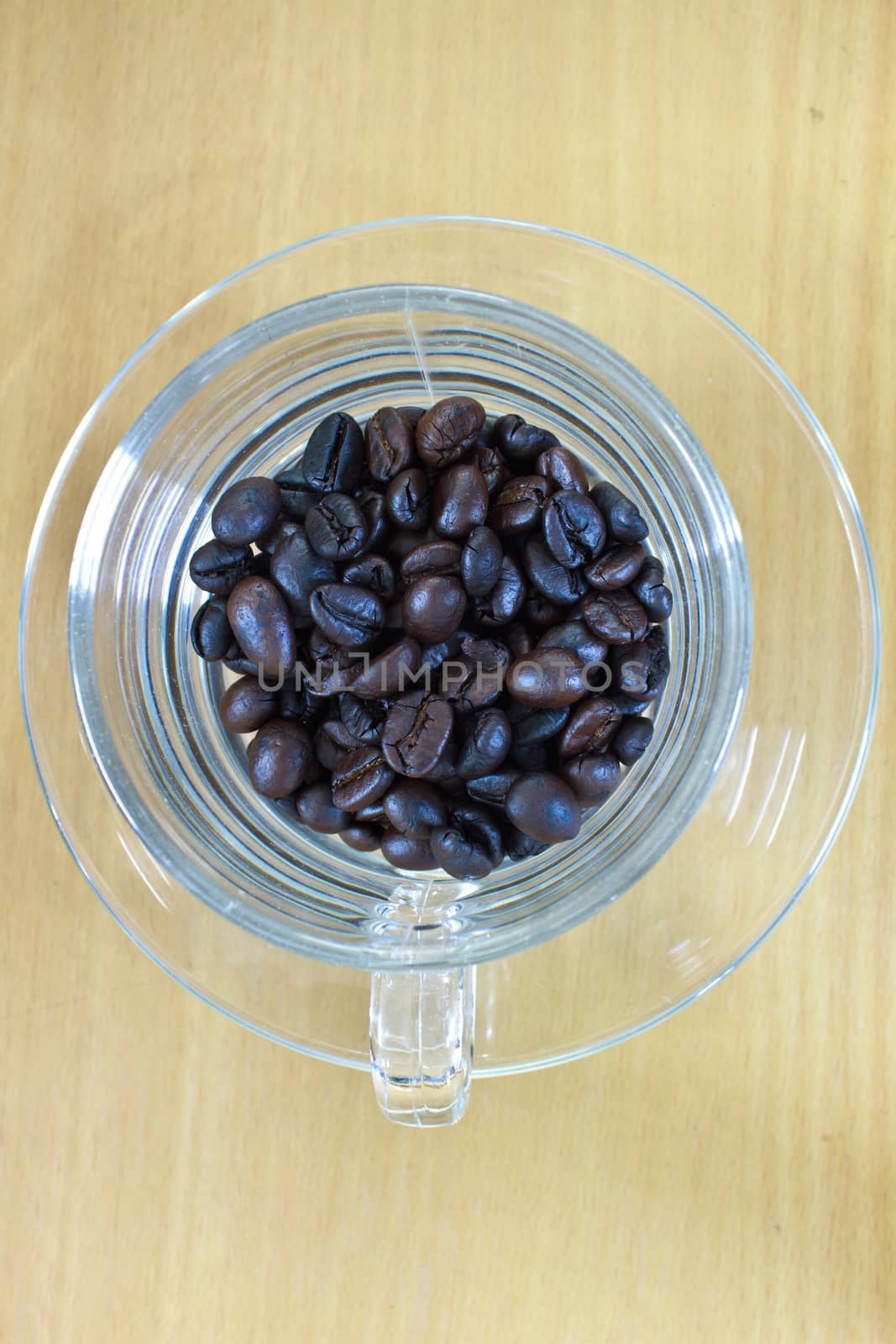 coffee beans in cup on the wood table