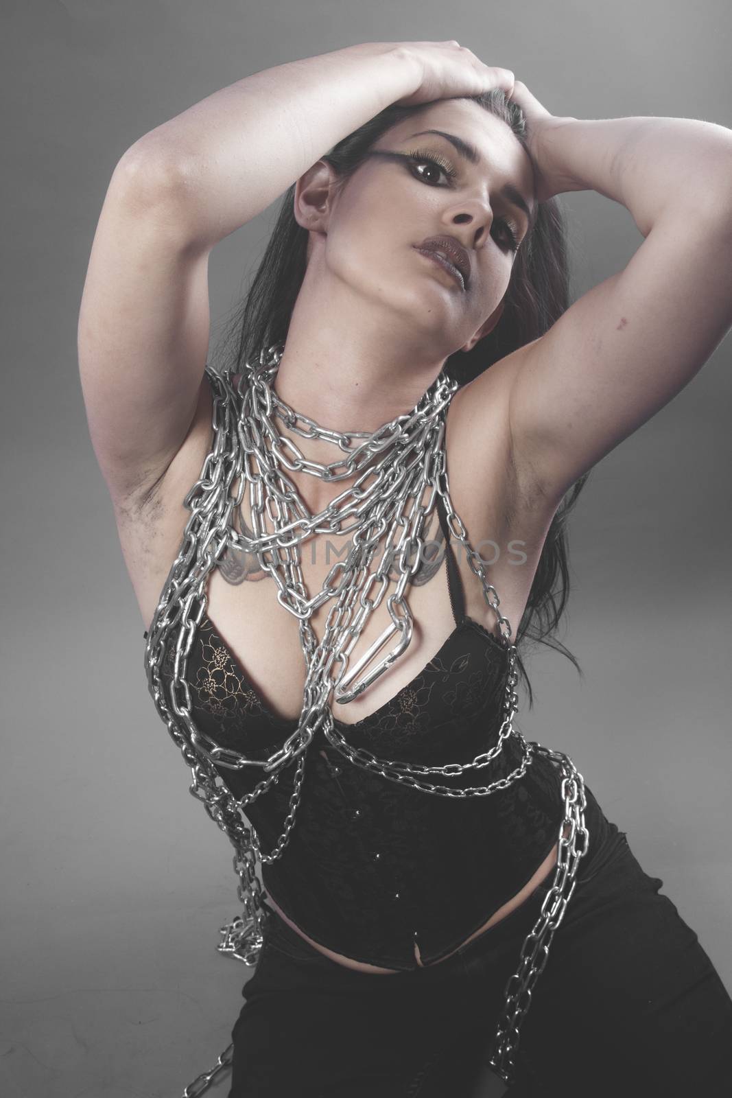 Slave, Beautiful brunette woman with big silver chains chained