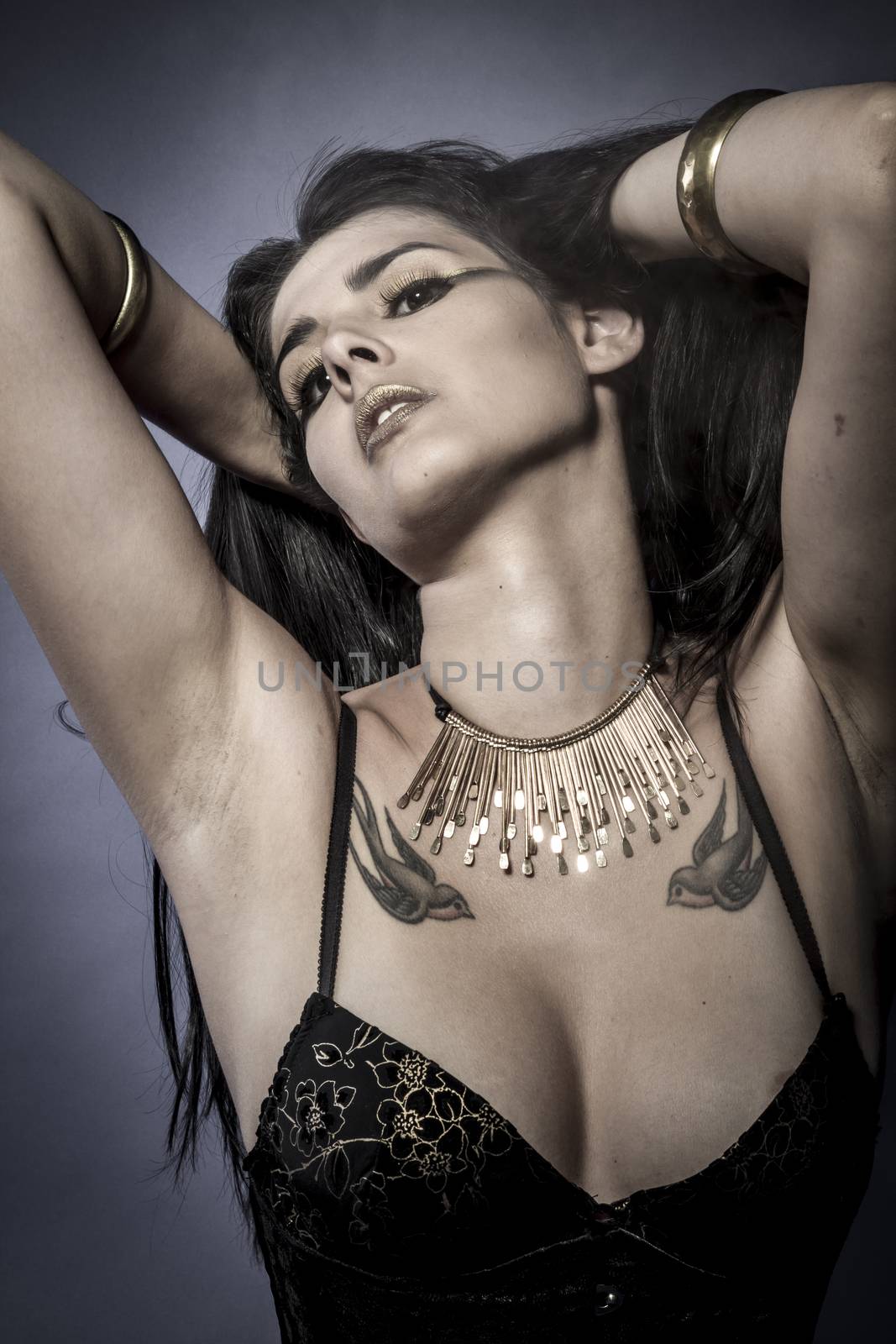 Sensual brunette dressed in black lingerie, golden jewelry by FernandoCortes