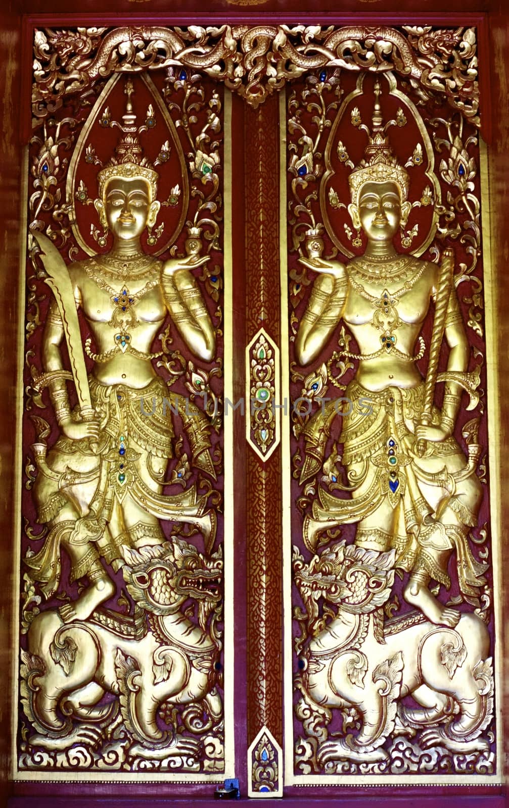 detail of wood carving with thai pattern on natural wood plate for decorated temple,Thailand