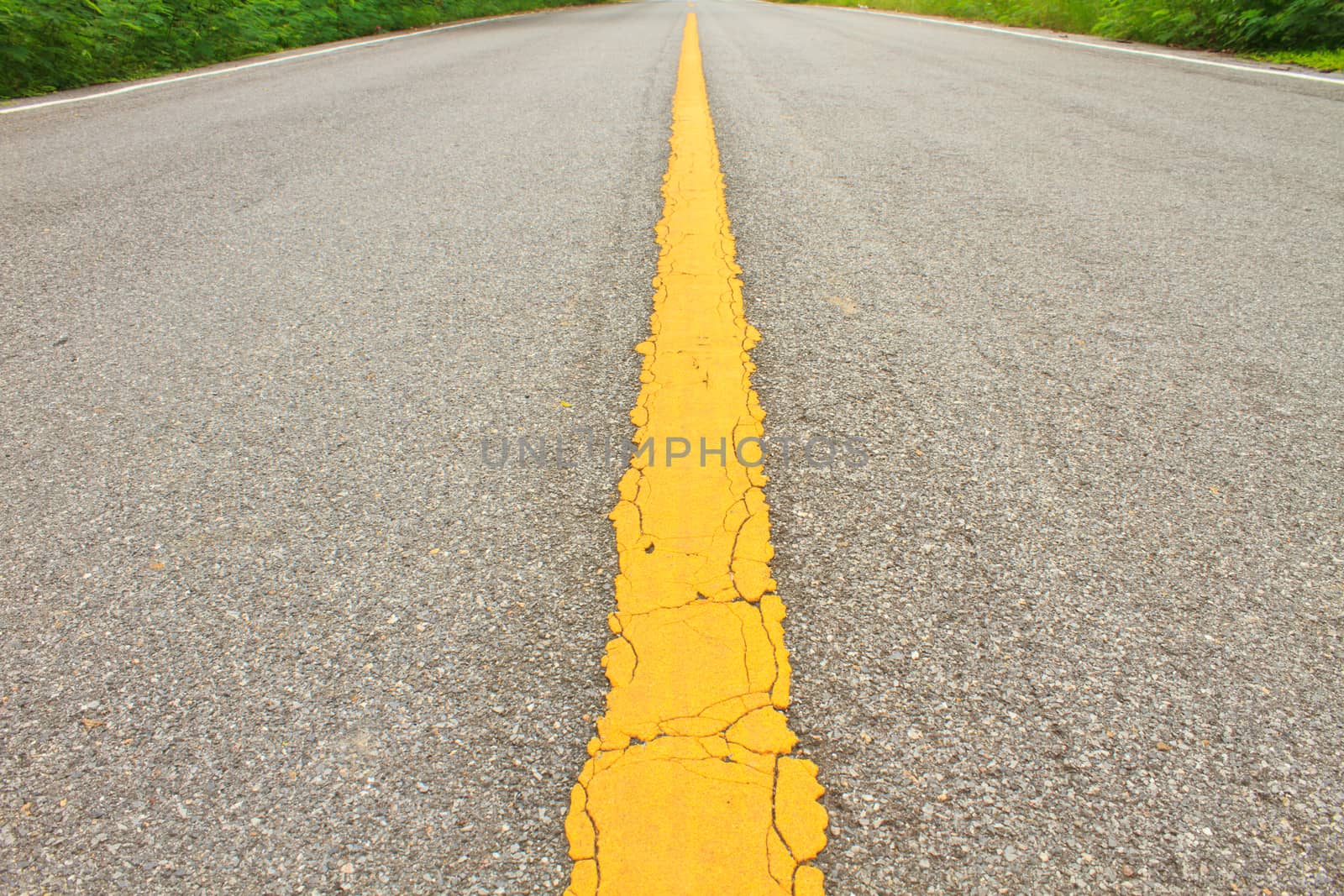 Asphalt dark texture with yellow lines