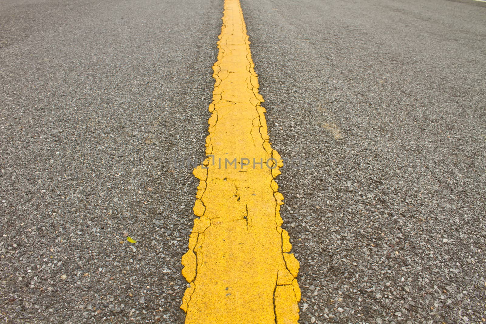Asphalt dark texture with yellow lines