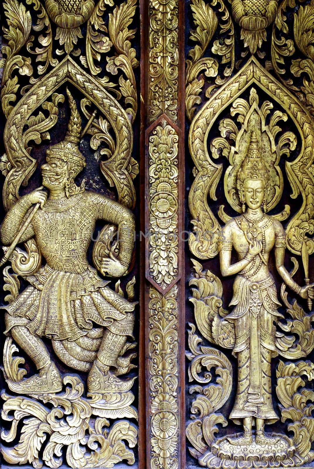 detail of wood carving with thai pattern on natural wood plate for decorated temple,Thailand