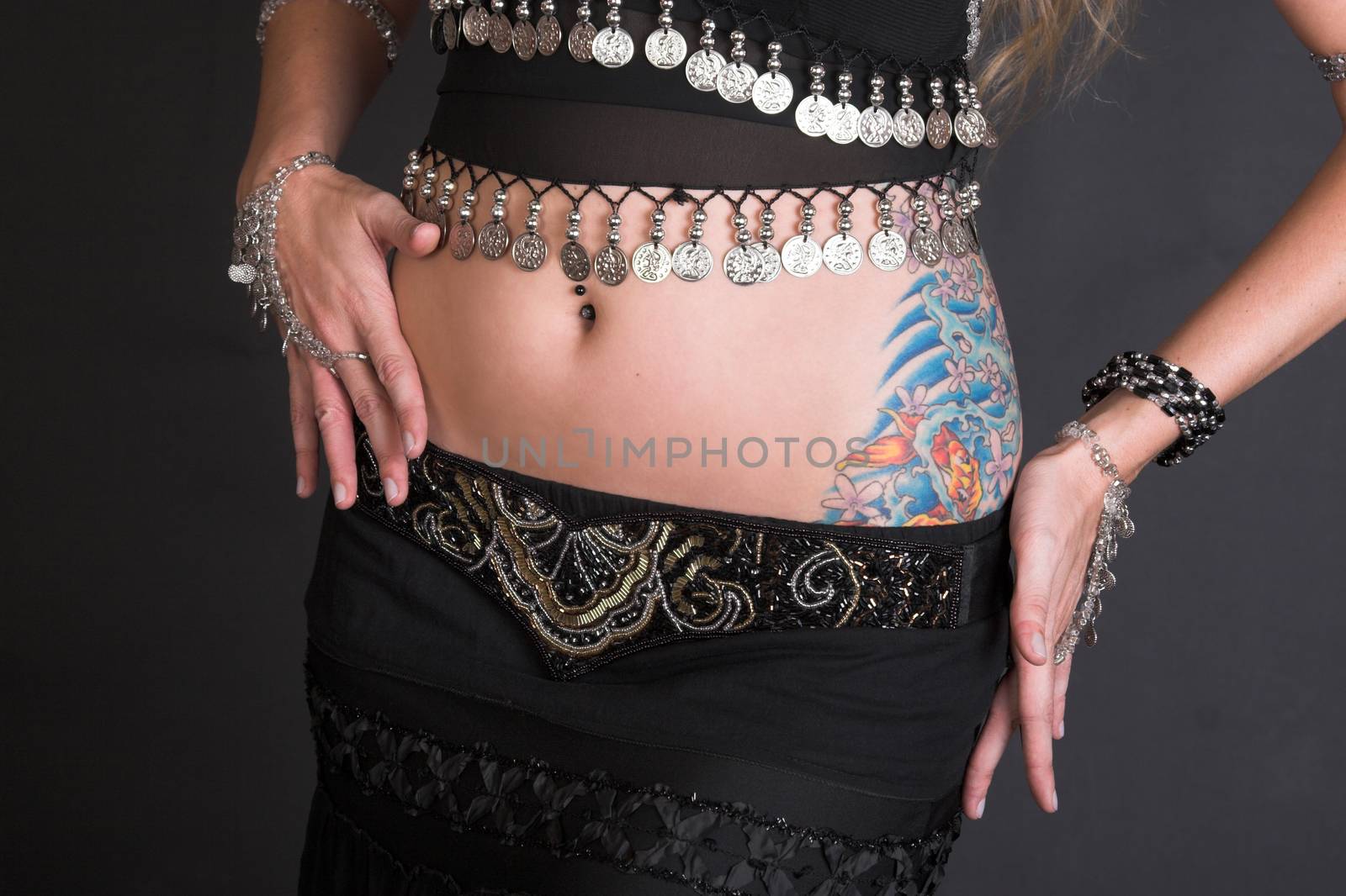 Belly Dancer with coin decorated costume and jewelery
