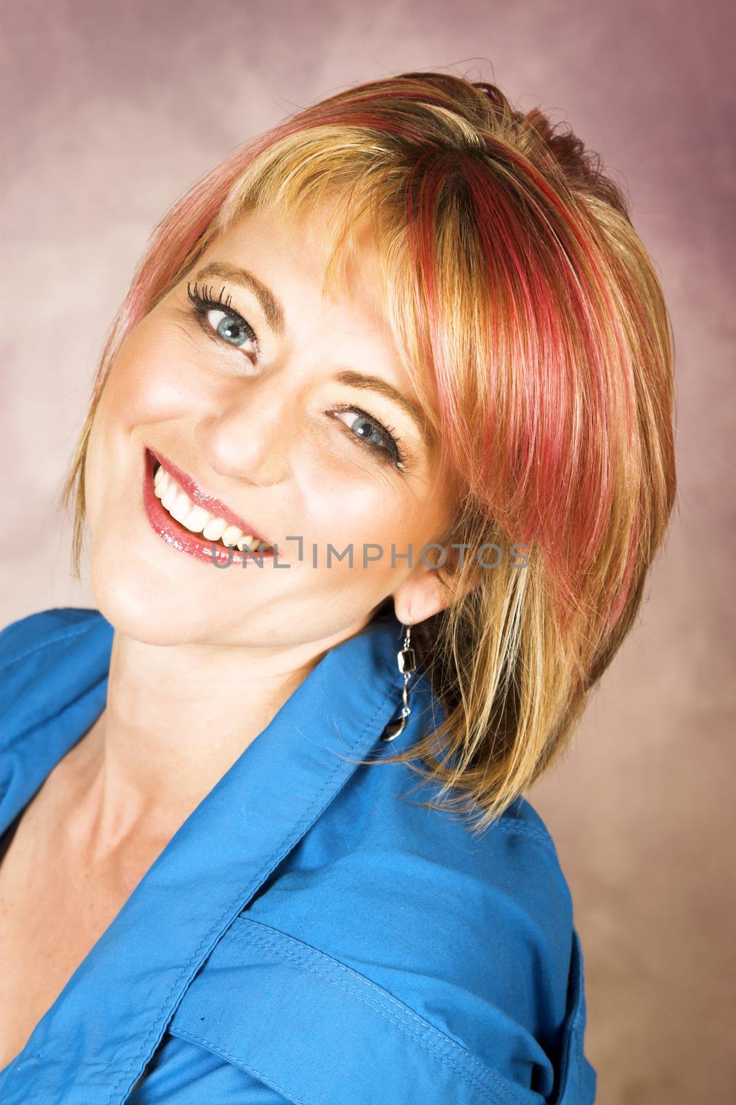 Beautiful blond female with red streaks in her hair