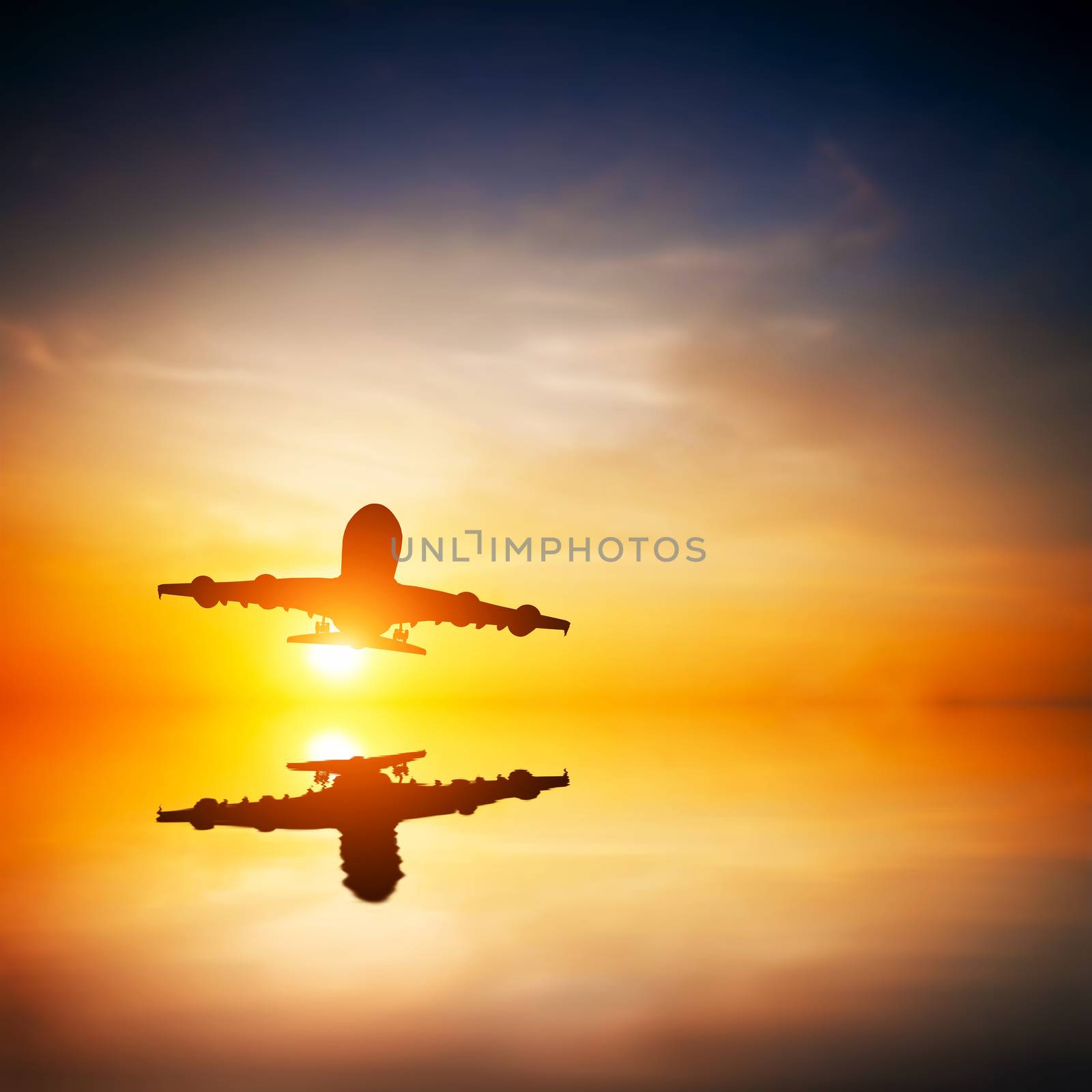 Airplane taking off at sunset. Silhouette of a flying passenger  by photocreo