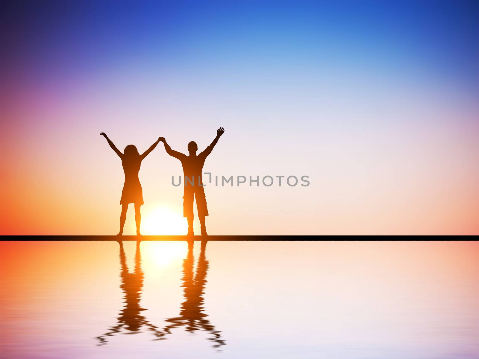 A happy couple in love standing together with hands raised at sunset with water reflection