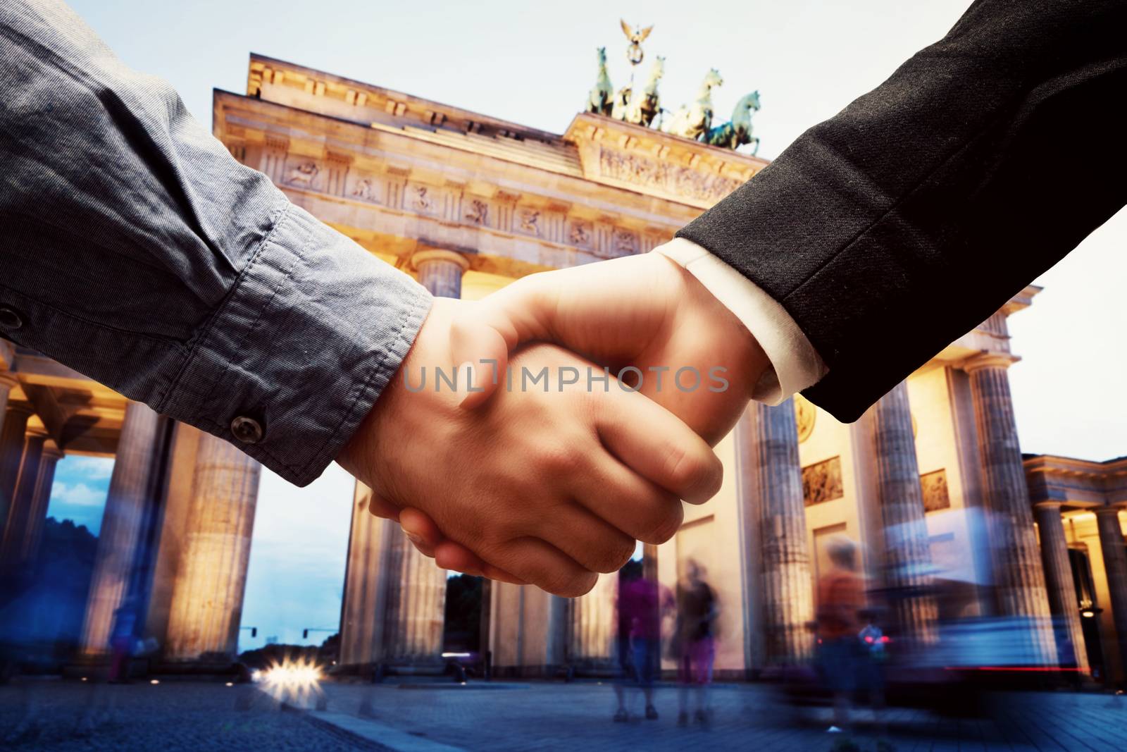 Business in Berlin. Handshake on Brandenburg Gate background. Deal, success, contract, cooperation concepts 
