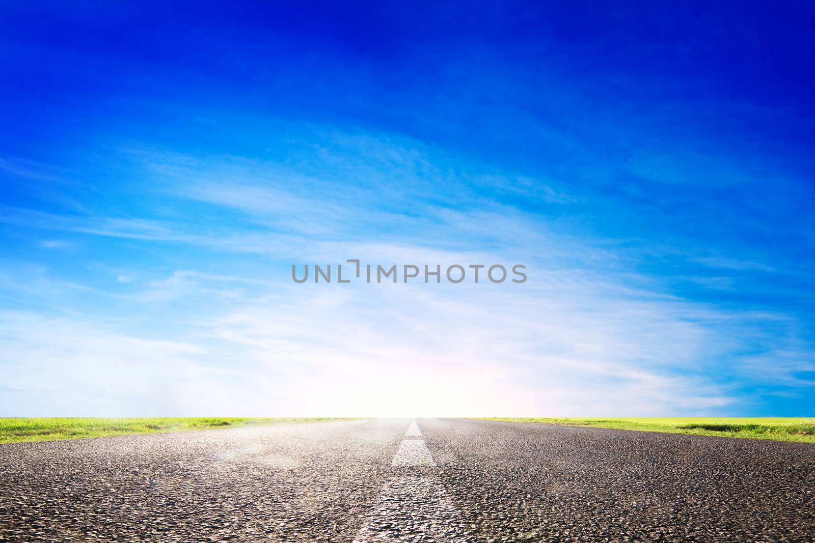 Long empty asphalt road, highway towards sun. Travel, transport concepts
