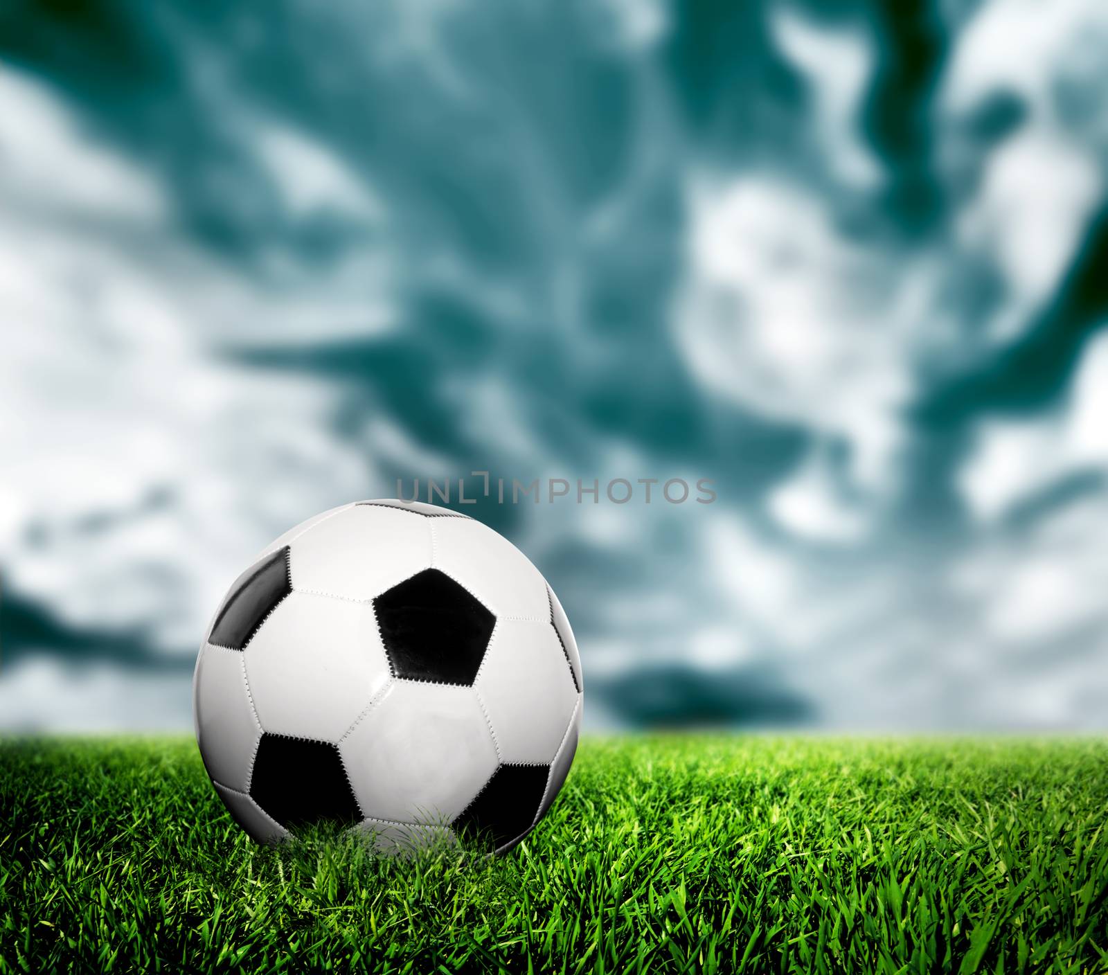 Football, soccer. A leather ball on grass, lawn. by photocreo