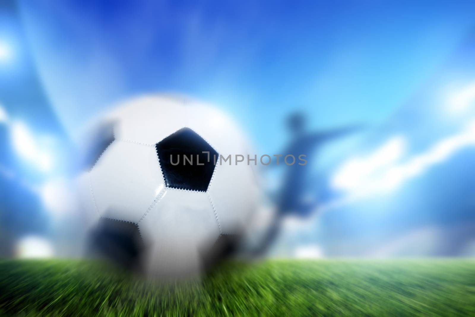 Football, soccer match. A player shooting ball on goal by photocreo