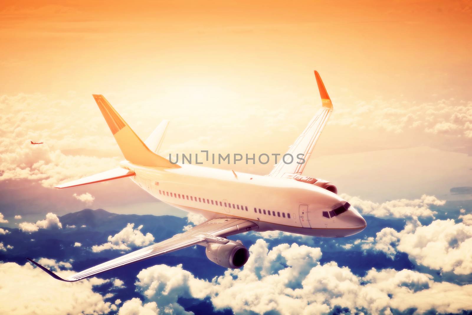 Airplane in flight. A big passenger or cargo aircraft, airline above clouds. by photocreo