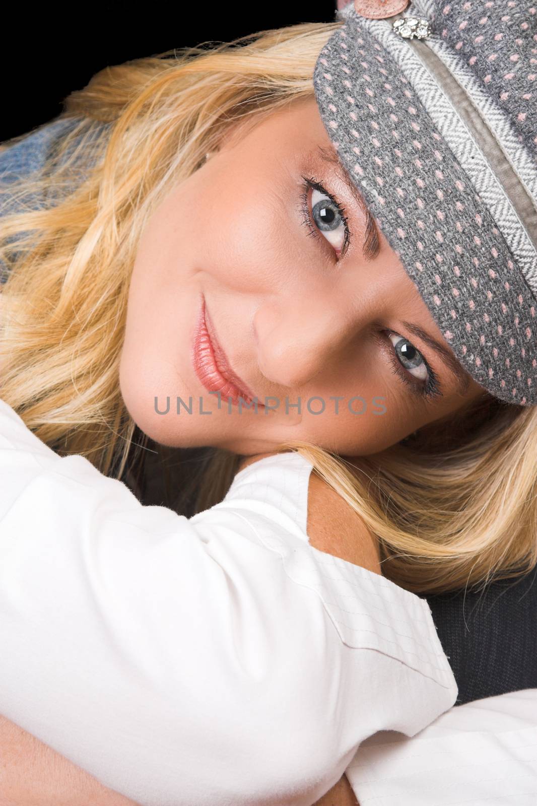 Beautiful Blond Adult model wearing a blue jacket