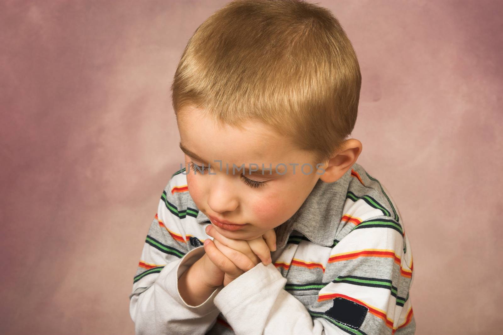 Young boy with short hair and beautiful facial expressions