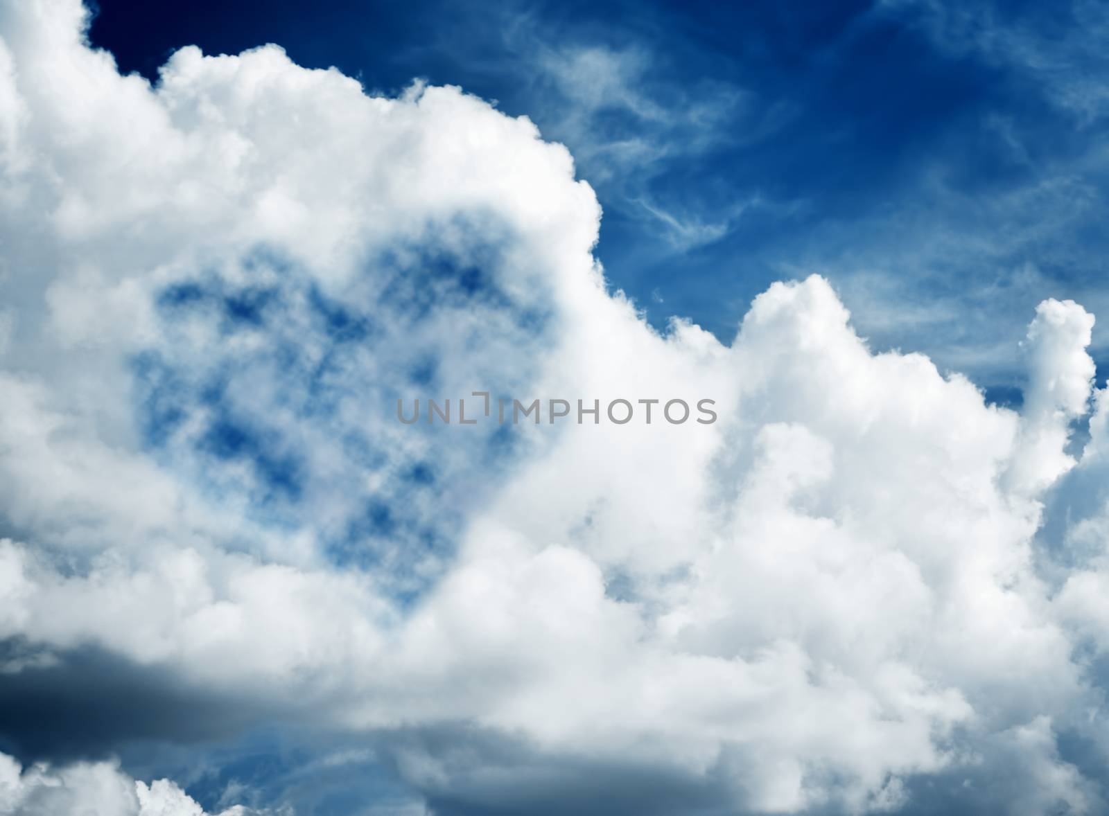 Heart shaped cloud on blue sunny sky. by photocreo