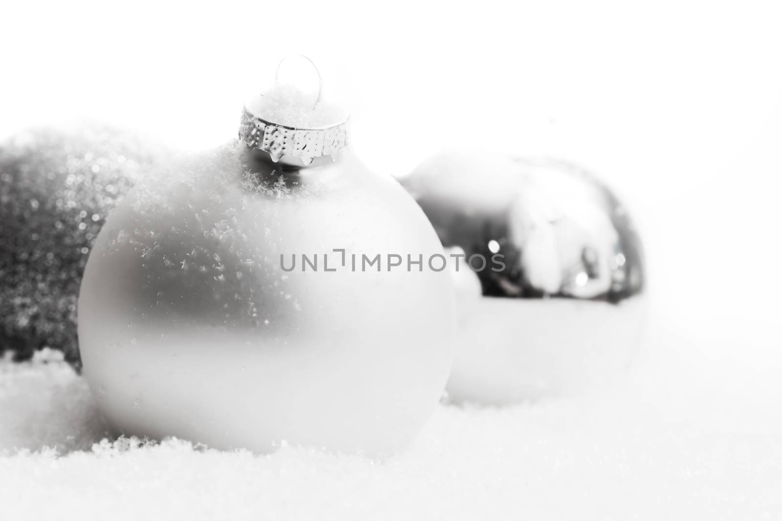 Christmas glass balls on snow, winter background by photocreo