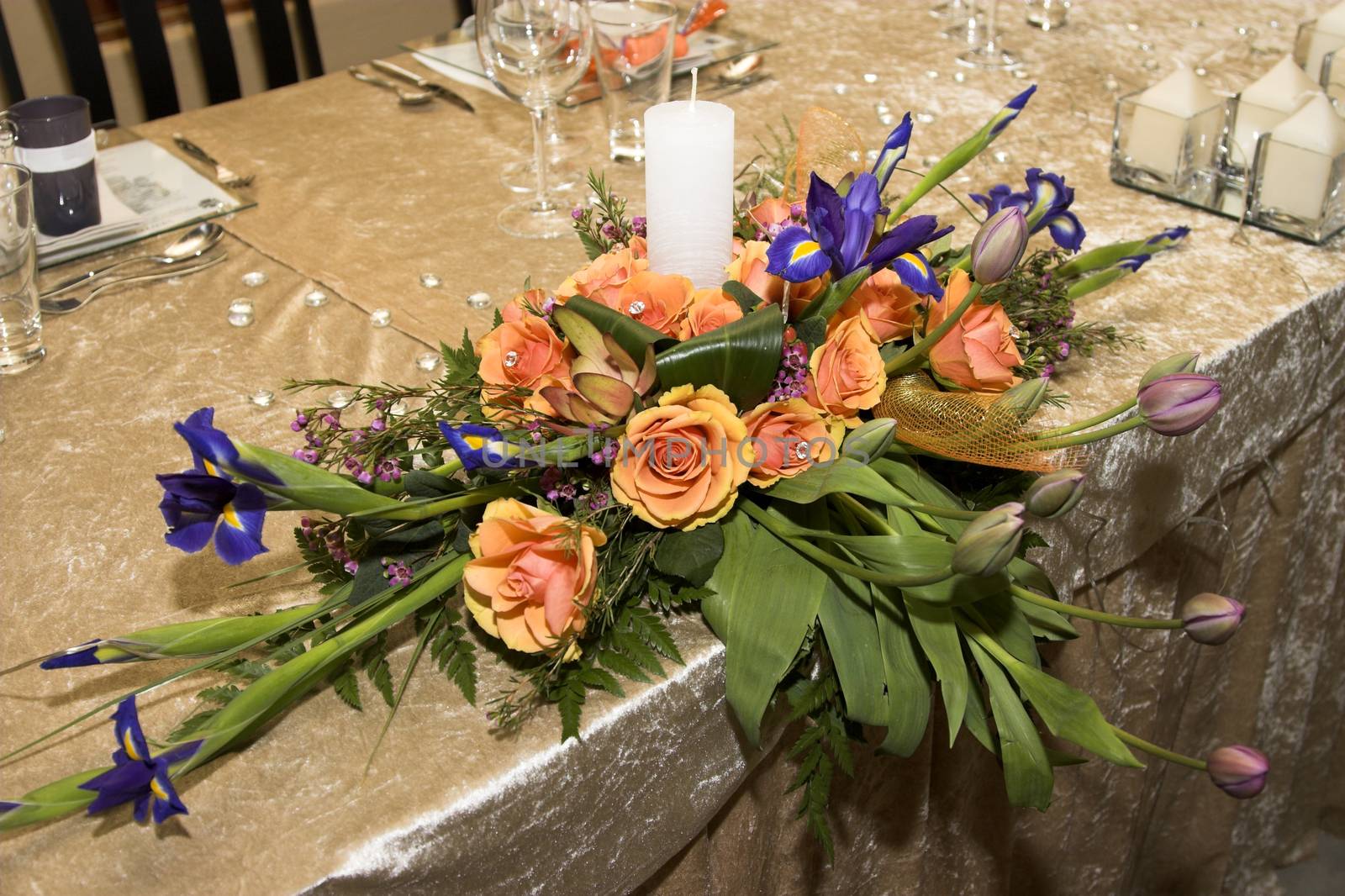 Wedding Table flower arrangement with orange roses