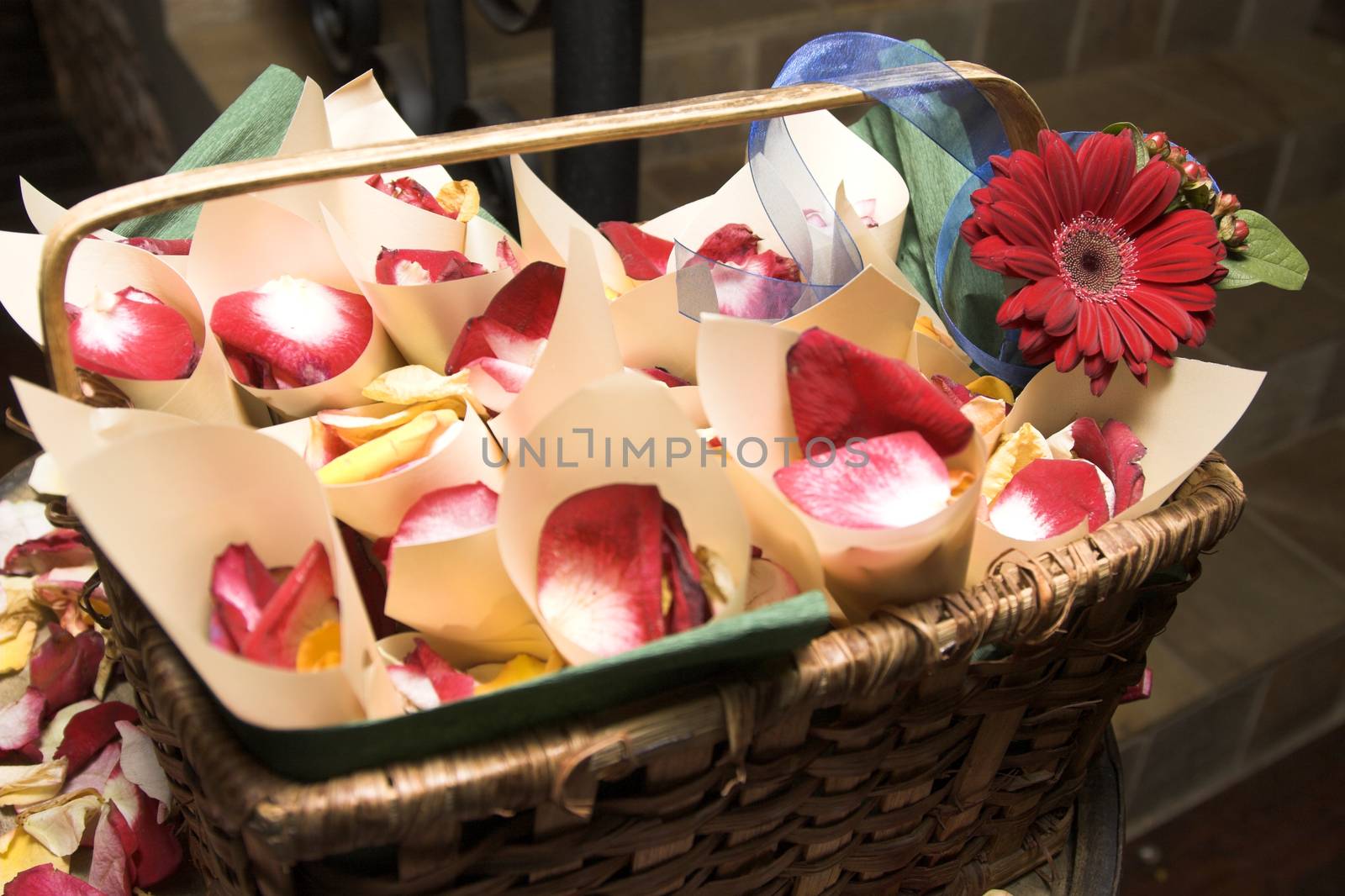 Basket containing cones filled with petals at a wedding